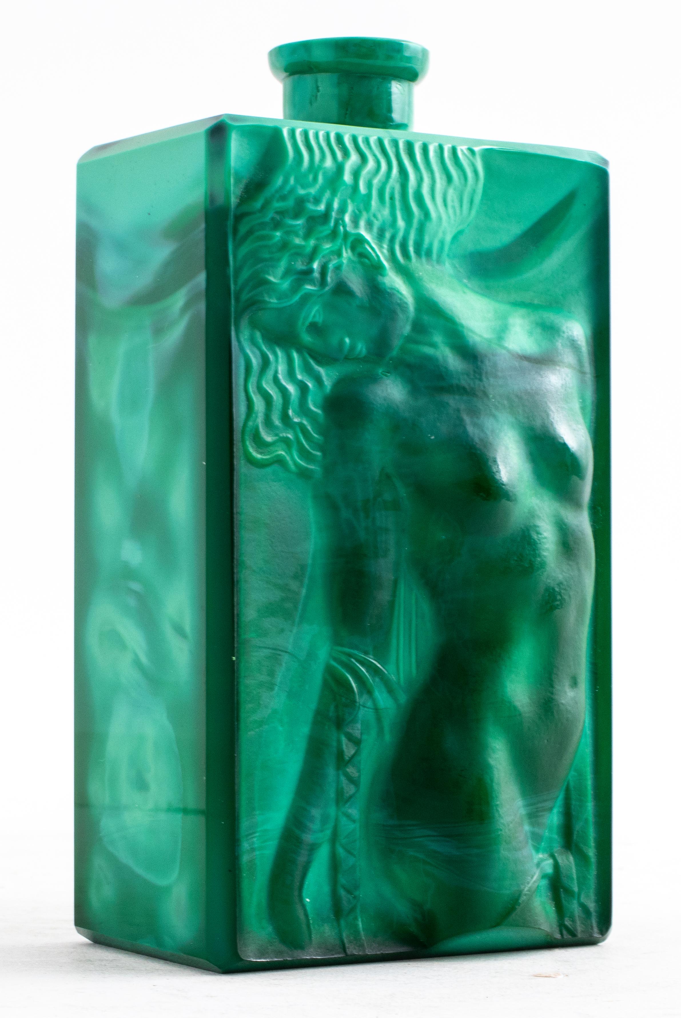 Faux malachite drinking vessel with a relief of a female nude on the front side. 

Dimensions: 1.75