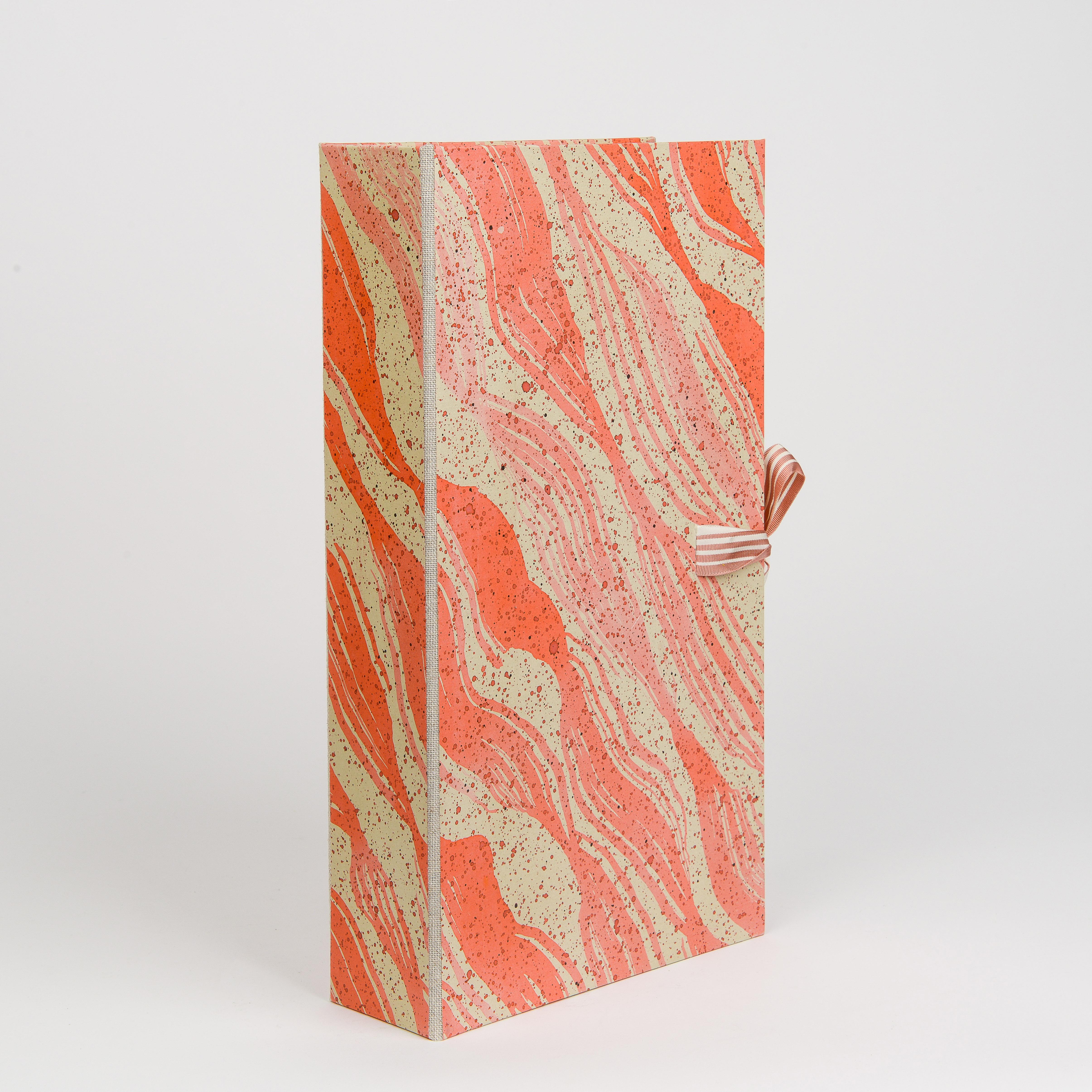 Unique hand-painted papier-mâché Document Box in a marbleized and speckled salmon, Coral, and beige design with complimenting tie ribbon.

From architectural follies of the eighteenth-century to crystalline rock formations, Thomas Engelhart