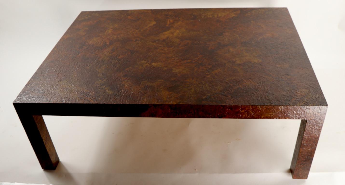 Brutalist School Parsons style coffee table constructed of textured formica on wood frame structure. Cool period table circa 1970's in very good original condition, showing only light cosmetic wear, normal and consistent with age. Each leg measures