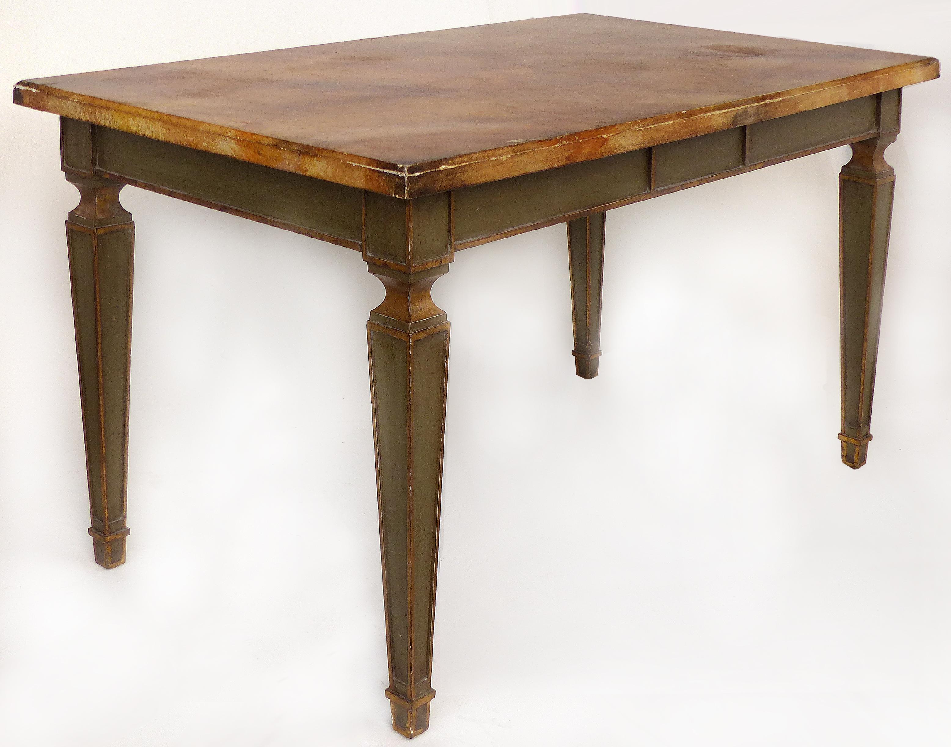 Faux Painted Writing Library Table with Green and Gilt Tapering Legs

Offered for sale is a faux-finished writing or library table with painted tapered legs and gilt accents. The top is artist faux-marble painted and the table is finished on all