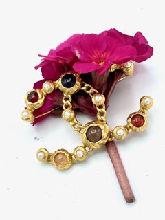 FAUX PEARL AND RESIN CHANEL CC BROOCH, gold plated, 2018 Collection