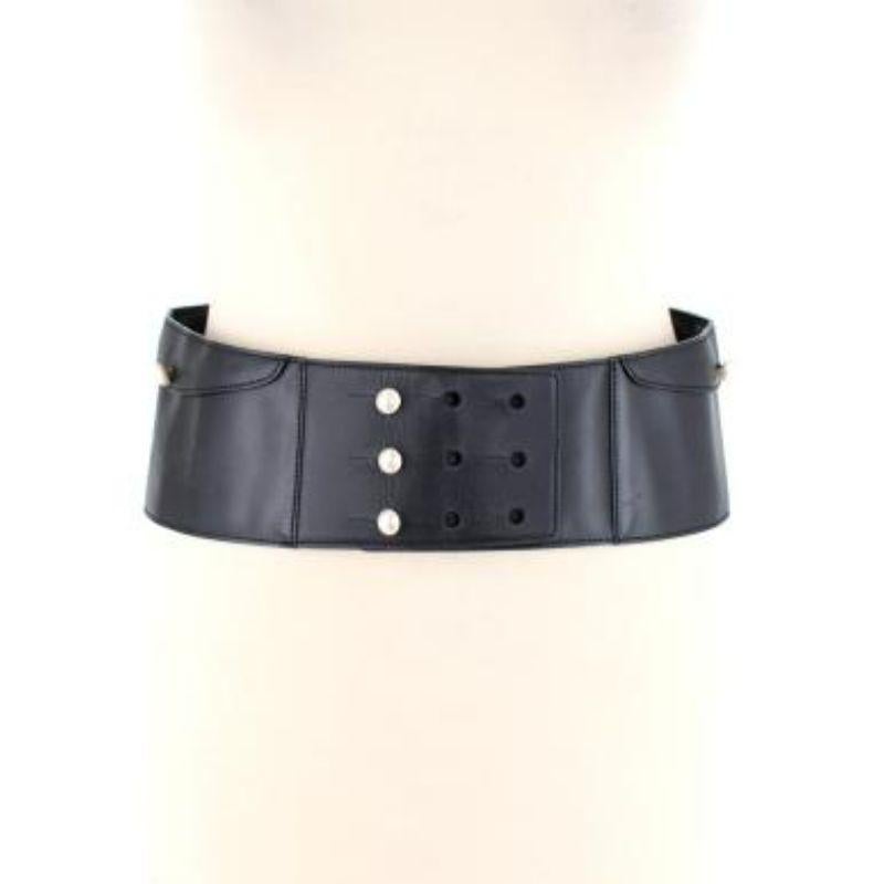 Chanel Faux Pearl Black Leather Logo Waist Belt
 
 
 
 - Supple black leather body
 
 - Embossed logo 
 
 - Flap pockets 
 
 - Pearl button stand fastening with Chanel print 
 
 - Lined with black leather 
 
 
 
 Materials:
 
 Leather 
 
 
 
 Made