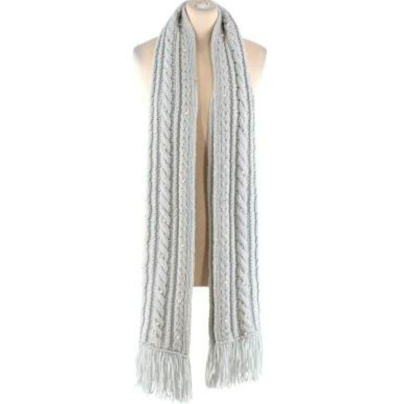 Valentino Pearl Embellished Light Blue Knit Scarf
 
 
 
 - Soft wool, cable knit body 
 
 - Faux pearl and bead embellishments scattered throughout 
 
 - Fringed edges 
 
 
 
 Materials:
 
 100% Cashmere 
 
 
 
 Made in Italy 
 
 
 
 Dry clean only