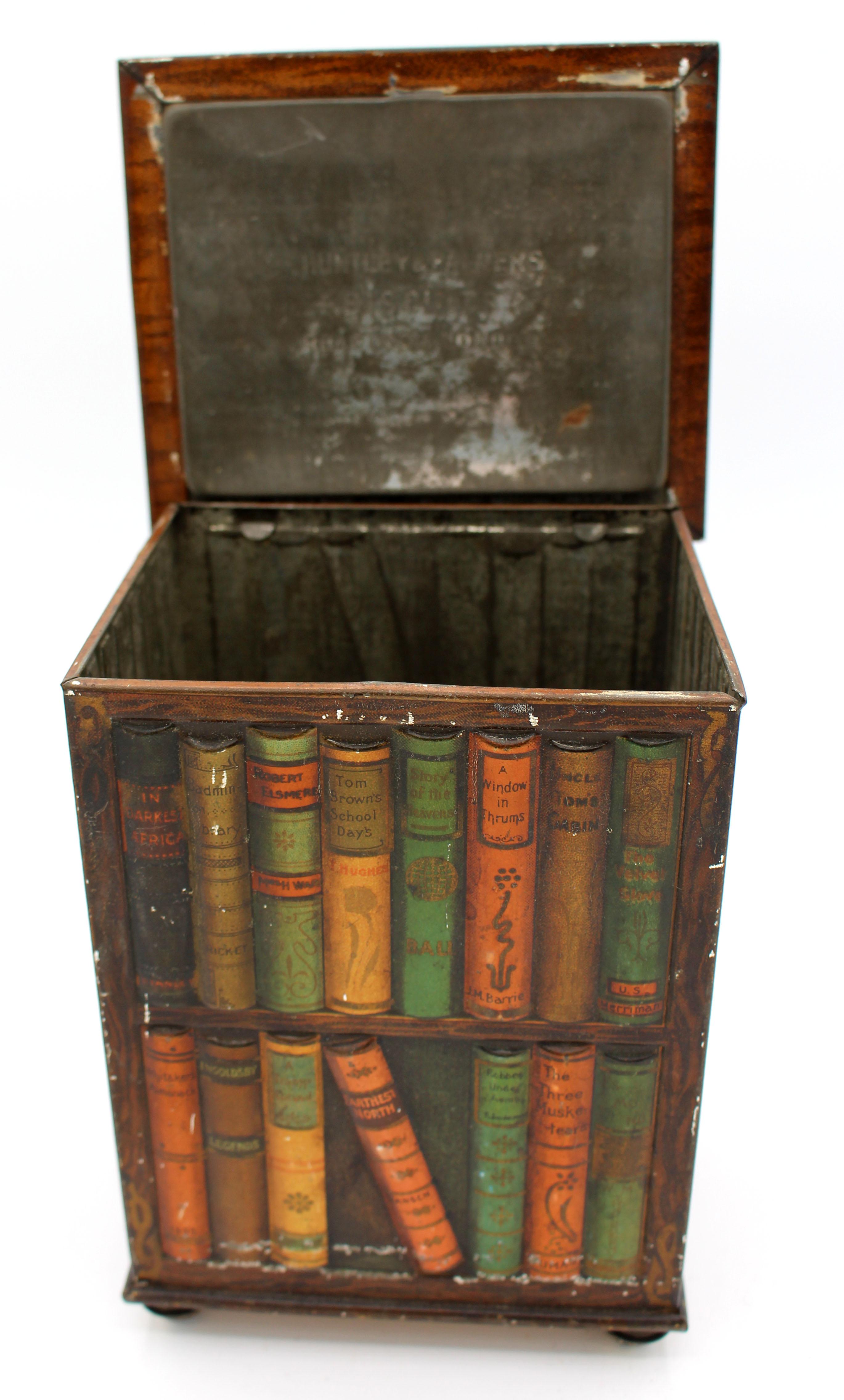 Faux revolving bookcase biscuit tin box by Huntley & Palmers, 1905, English. In the form of a revolving bookcase filled with classic novels, notice the detail - end covers show on sides. Overall good condition given age & use, tiny edge