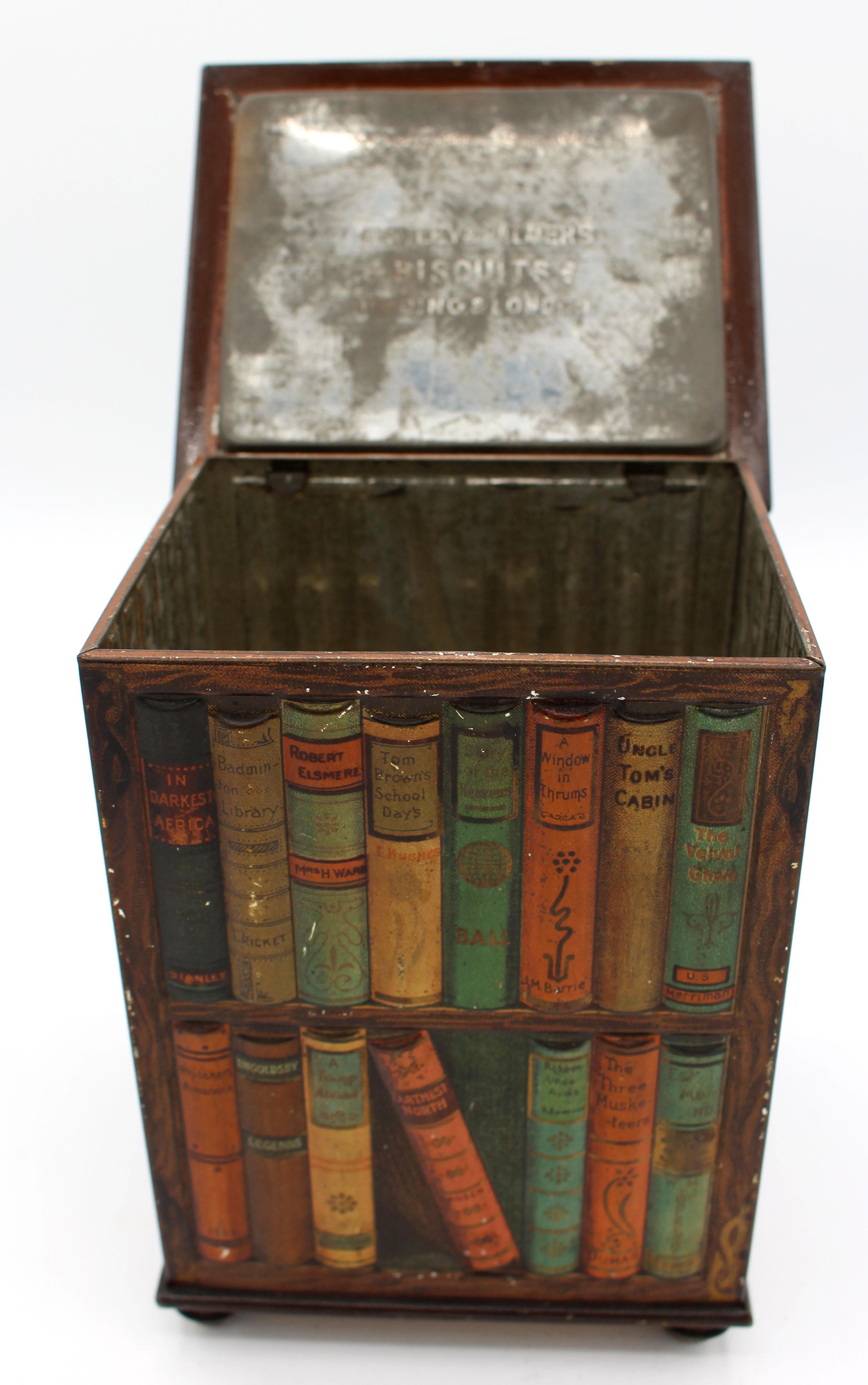 Faux revolving bookcase biscuit tin box by Huntley & Palmers, 1905, English. In the form of a revolving bookcase filled with classic novels, notice the detail - end covers show on sides. Overall good condition given age & use, top darkened & minor