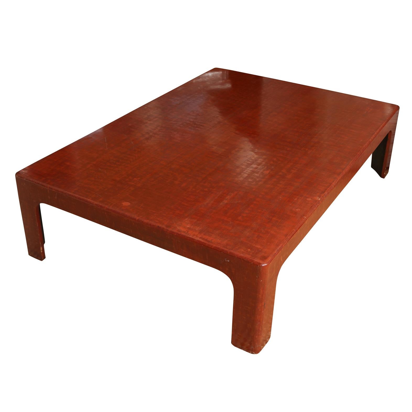 A faux rosewood coffee table in Asian style.