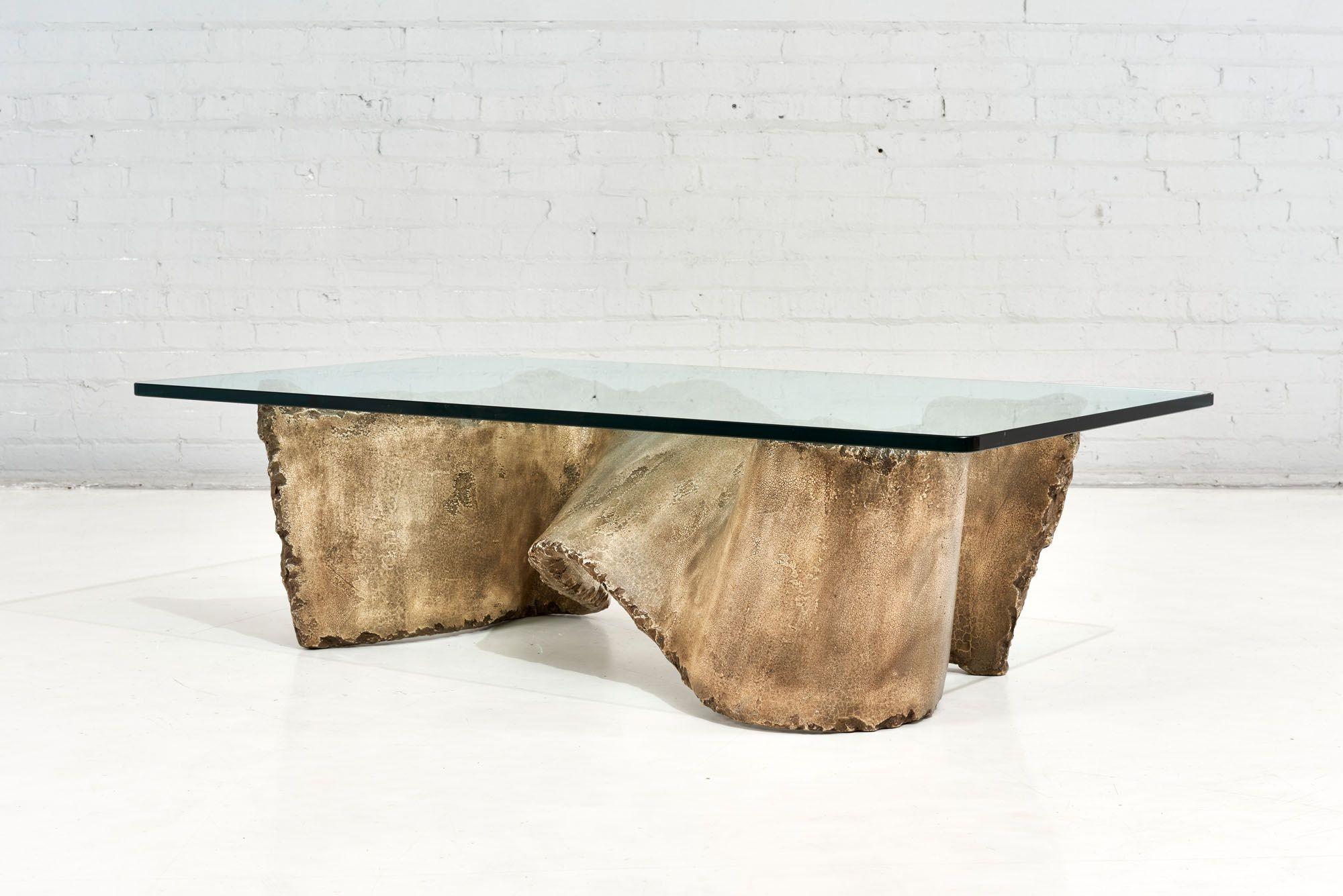 Faux Stone “Miro” sculpture coffee table, Silas Seandel 1970. Fauc chiseled stone in ribbon form with glass top.