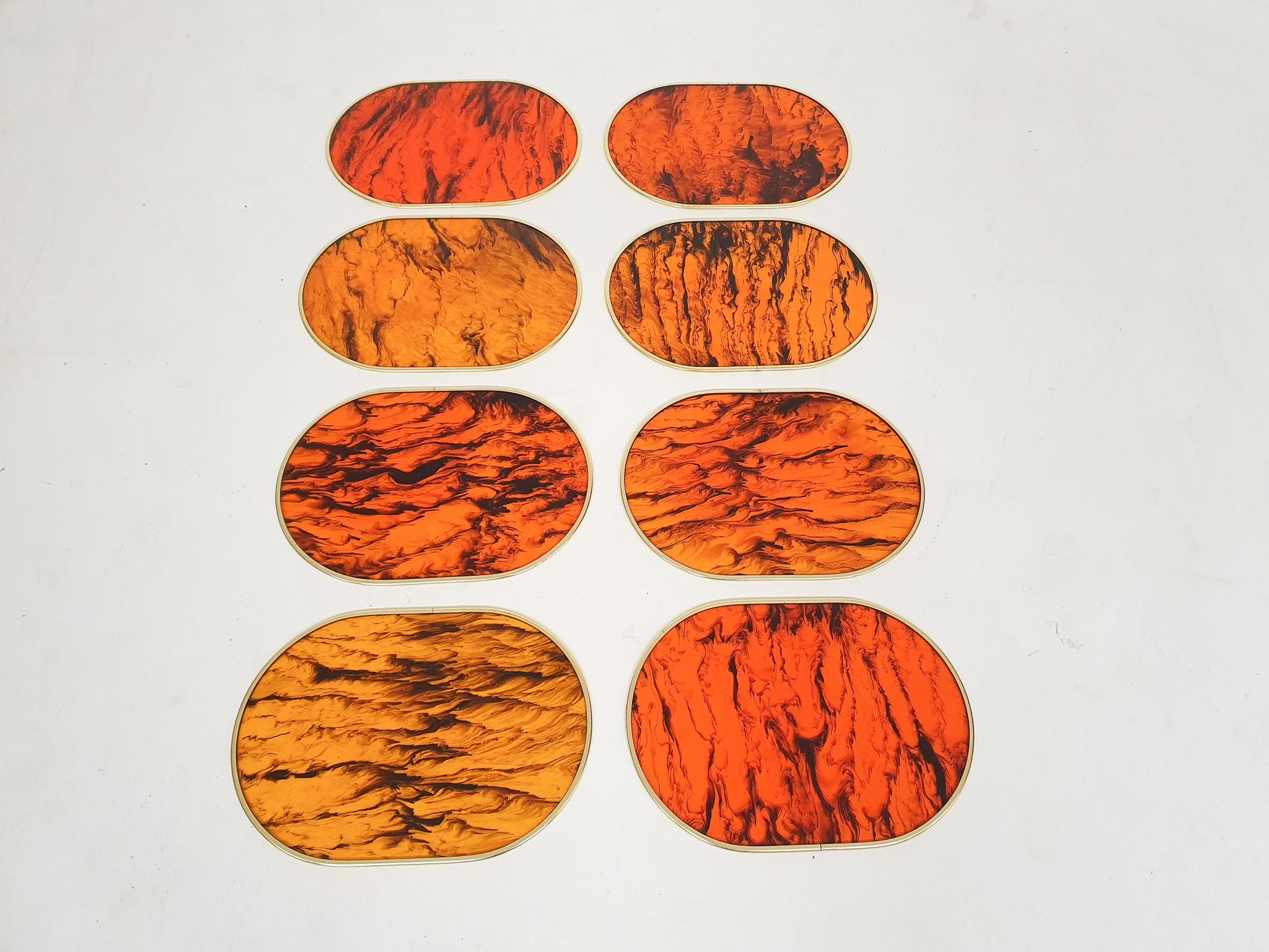 Set of 8 lucite faux tortoise shell placemets with a gold plastic edge. All with a unique pattern.
In good condition.