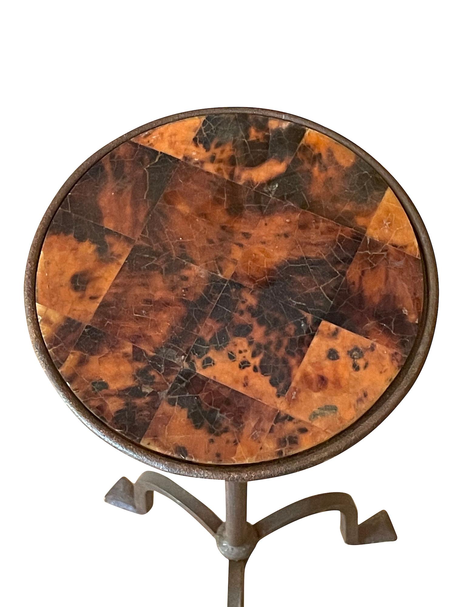 Contemporary Spanish iron tripod leg martini table.
Decorative faux tortoise top.
