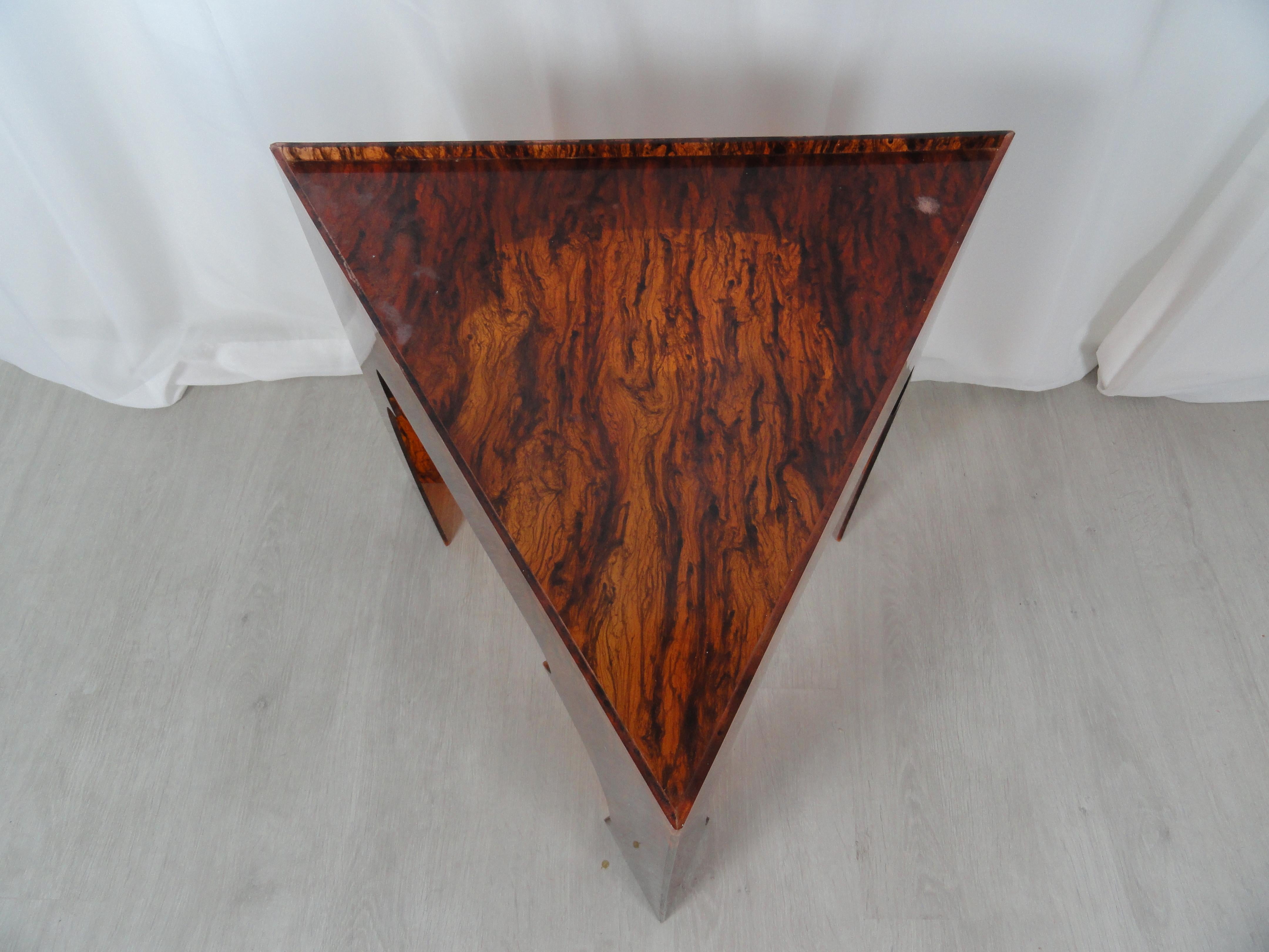 Faux tortoiseshell acrylic triangle table. Measures 21
