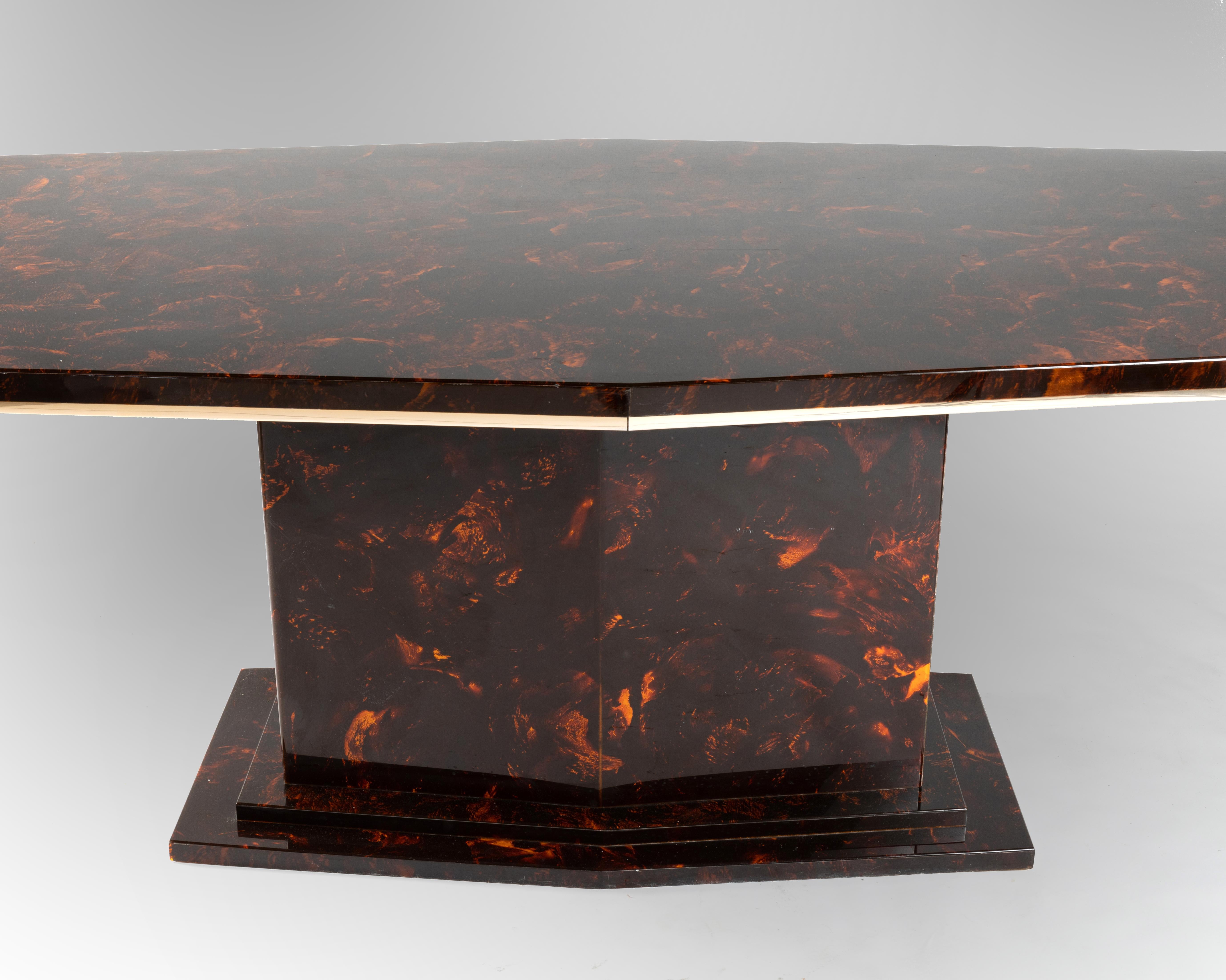 Faux tortoiseshell dining table with hexagonal top. Chrome frame.