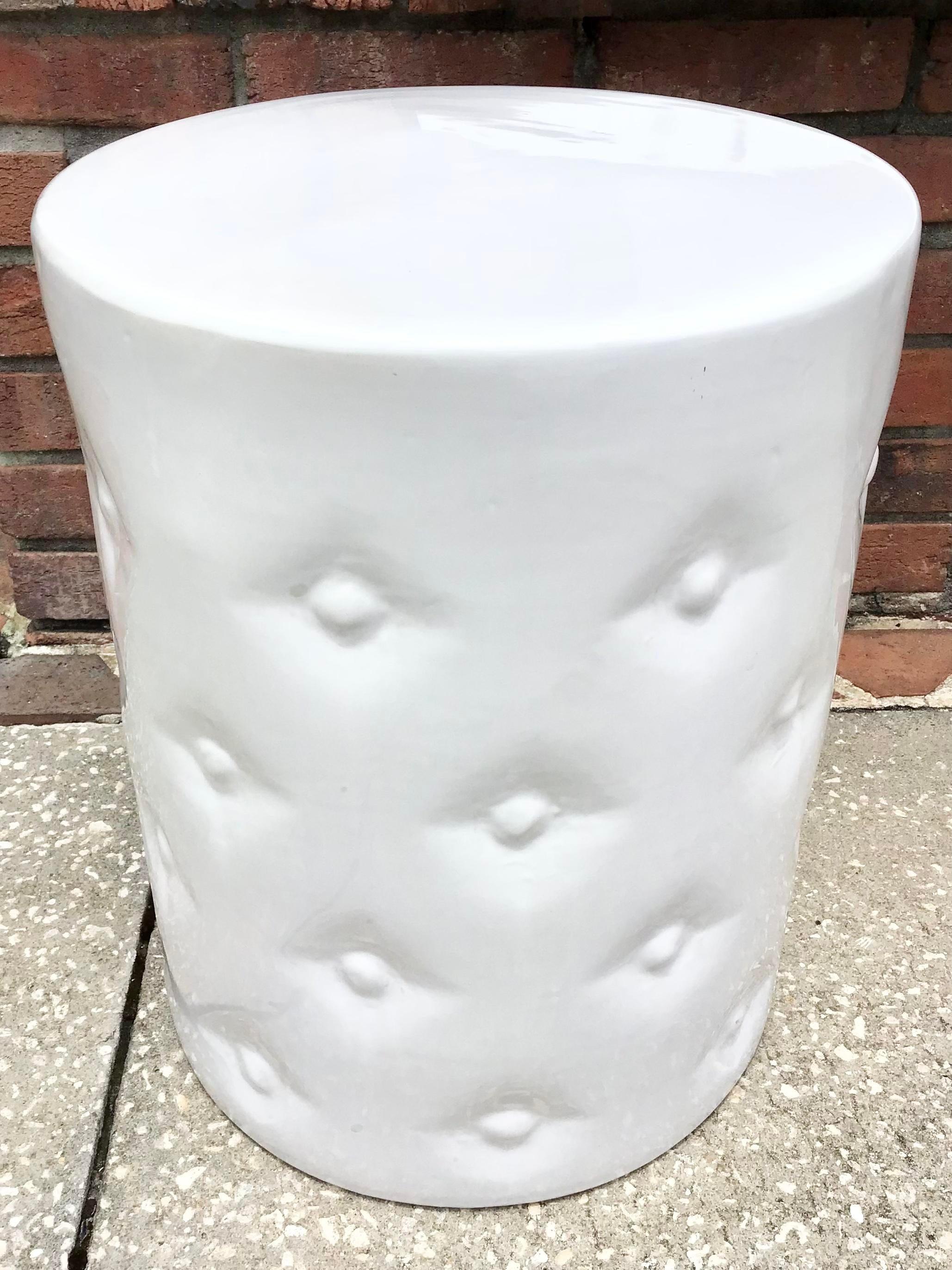 Gorgeous piece of faux cushion white ceramic garden seat in white. This can absolutely function as a cocktail table for your indoors or patio.