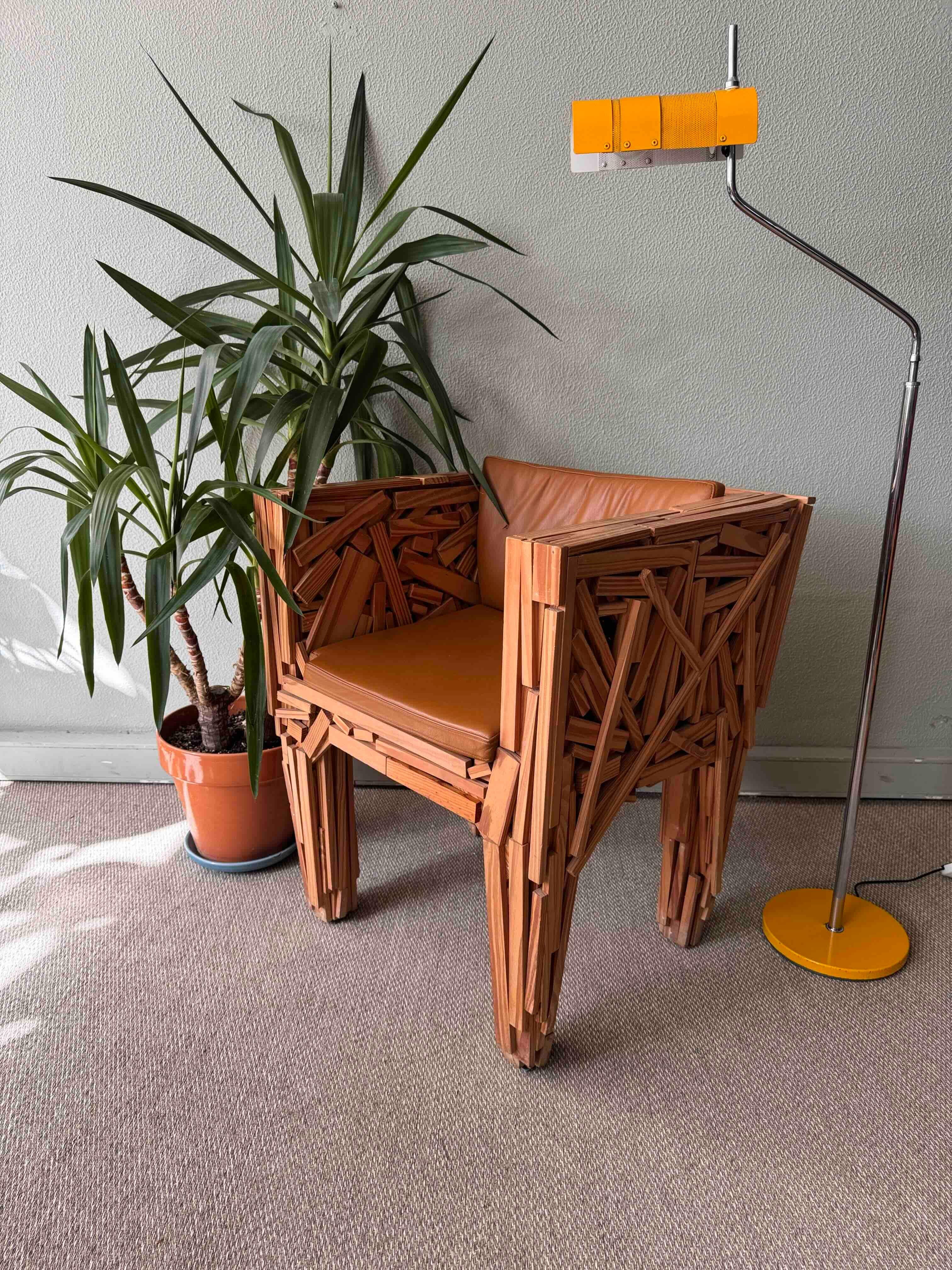 
Favela Chair by Campana Brothers for Edra, 1994

Designed by Fernando and Humberto Campana, the Favela Chair is a remarkable example of their groundbreaking approach to design and craftsmanship. Handcrafted with numerous hand-nailed strips of pine
