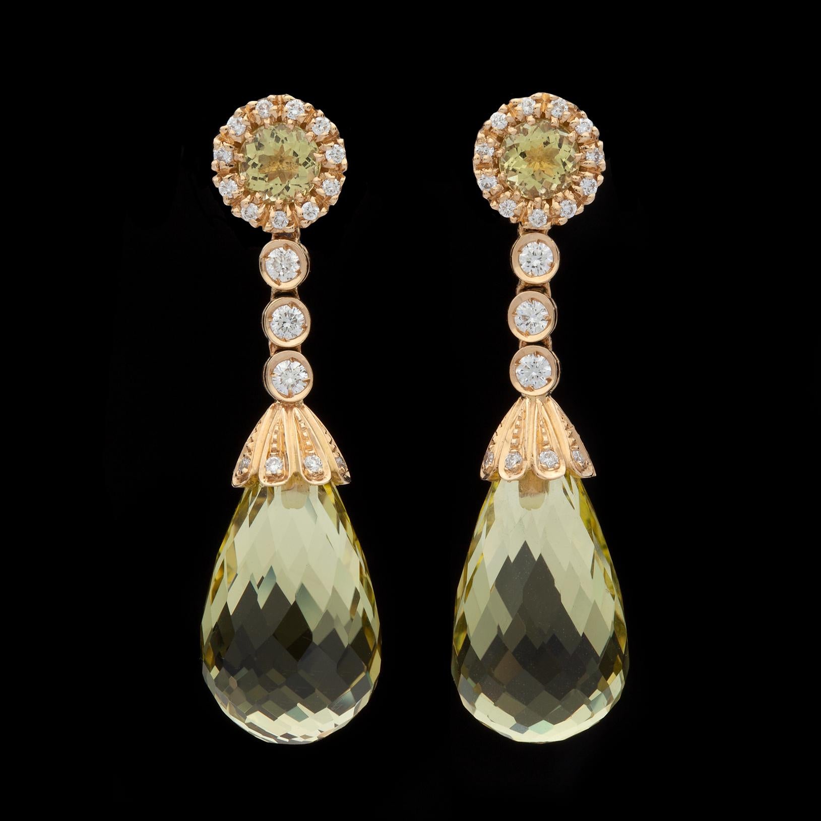 Favero quartz & diamond earrings, set in 18k yellow gold and featuring 4 mixed cut quartz weighing approximately 23.15 ct. tw. accented by approximately 0.59 ct. tw. of round brilliant cut diamonds. The earrings weigh 9.18 grams, and measure 1 1/2