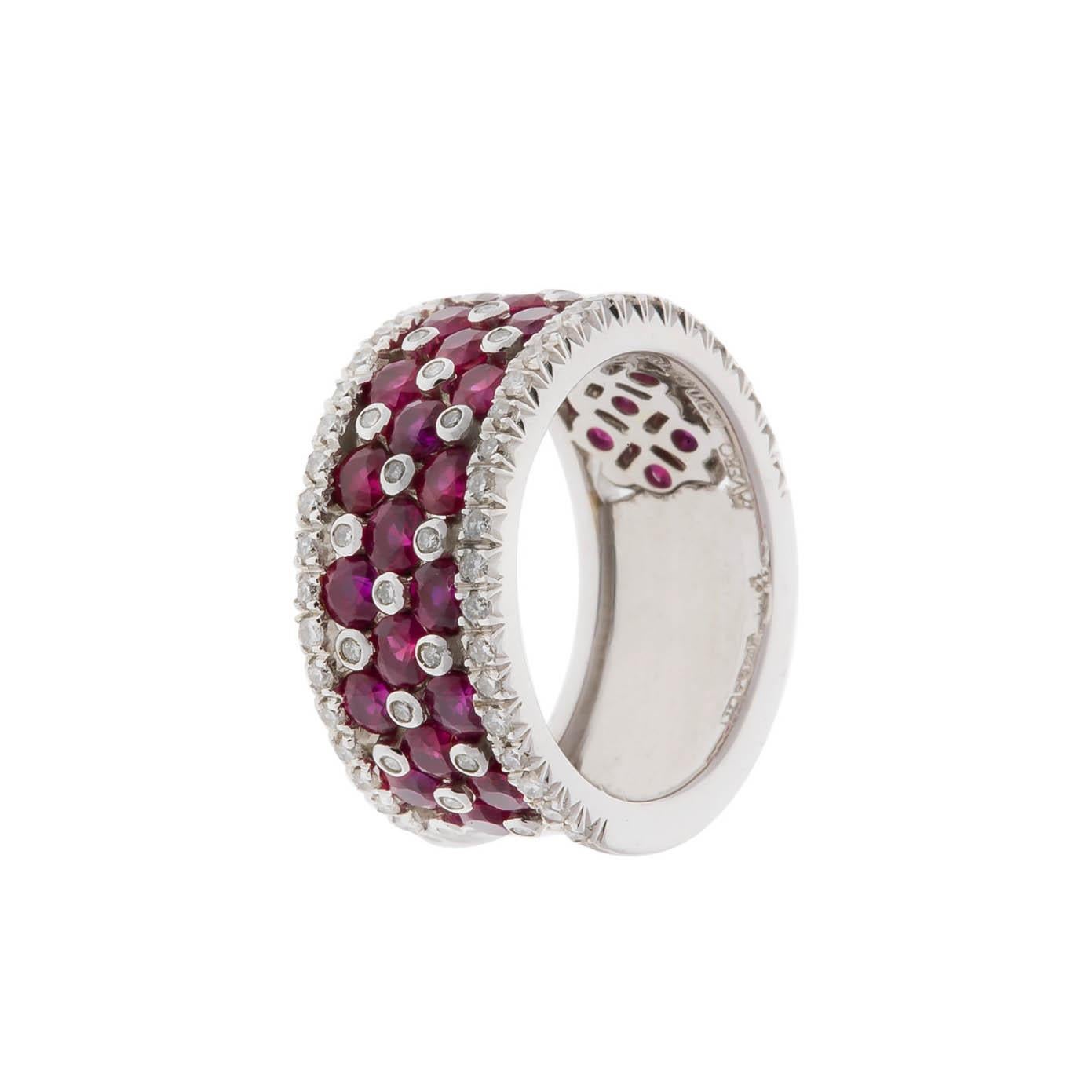 Favero 18K white gold ruby and diamond band containing 3.24 carats of round rubies and 0.48 carat of round diamond.
Size 6 1/2. This ring can be sized.