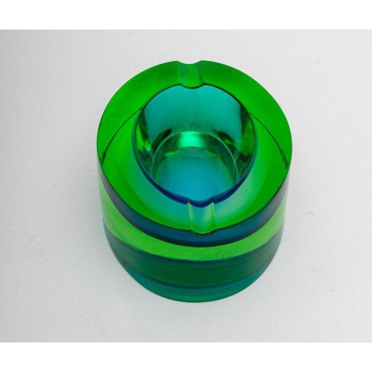 Questo elegante portacenere in vetro di Murano, realizzato da Flavio Poli, risale agli anni '70 e il suo colore blu-verde è noto come vetro uranio.