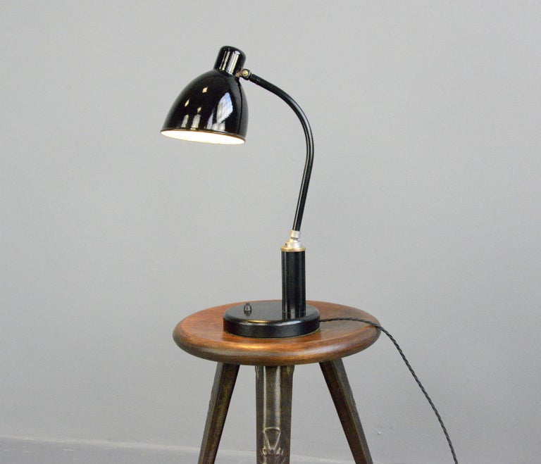 Favorit model desk lamp by Molitor, circa 1930s

- Vitreous enamel shade
- Bakelite handle
- On/Off switch on the base
- Concrete base
- Original base plate 
- Takes E27 fitting bulbs
- Adjustable arm from the ball and socket joint
- Made