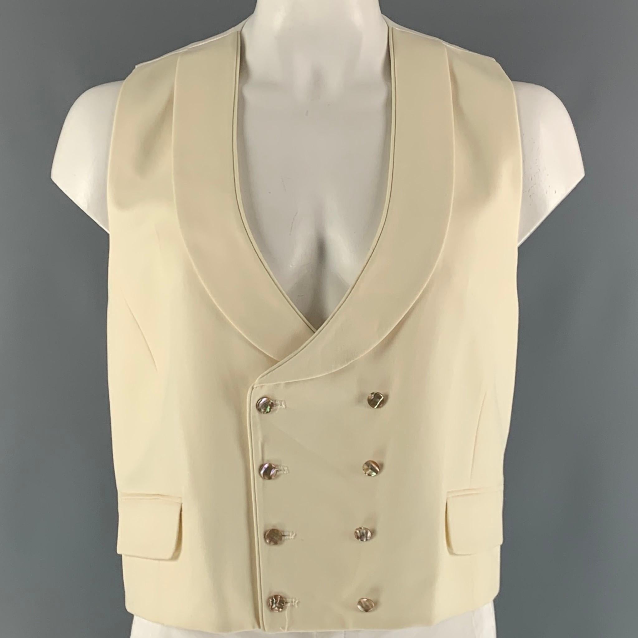 FAVOURBROOK u-neck vest comes in a beige and white wool woven material featuring a shawl collar, flap pockets, double brest, back belts, and a mother of pearls buttoned closure. Made in England.

Excellent Pre-Owned Condition.
Marked: no size