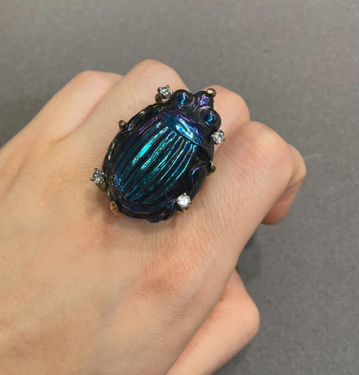 Favrile Glass Scarab Ring

Large favrile glass ring featuring a scarab beetle, accented with four round-cut diamonds. 

Ring Size: 9
Complimentary resizing 
Metal Type: 14 karat gold 

