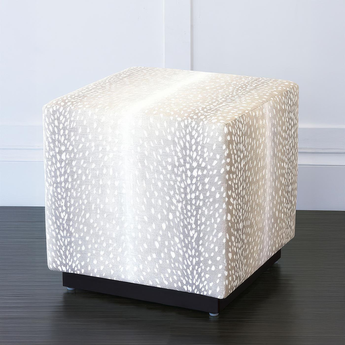 A striking blend of modern elegance and timeless comfort, the ottoman adds a sophisticated touch to any interior. Featuring an ombre gray animal-print upholstery, this chic ottoman is thickly padded and tightly upholstered for a tailored look.

Its