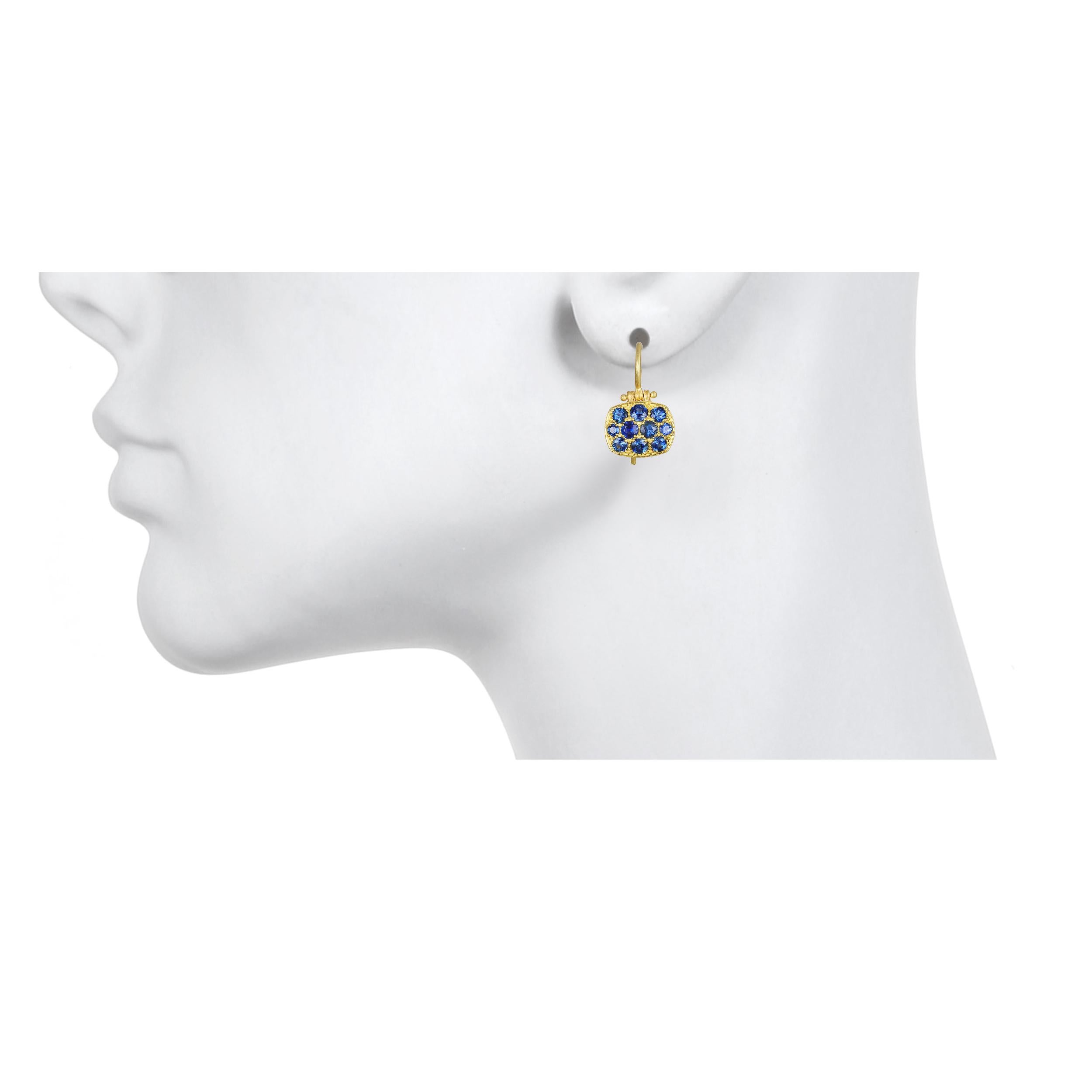 Faye Kim 18 Karat Blue Sapphire Chiclet Earrings

These bright and bold blue sapphire chiclet earrings have just enough sparkle to get noticed but with understated elegance.  Hinged for movement, uniquely shaped and light-weight make these earrings