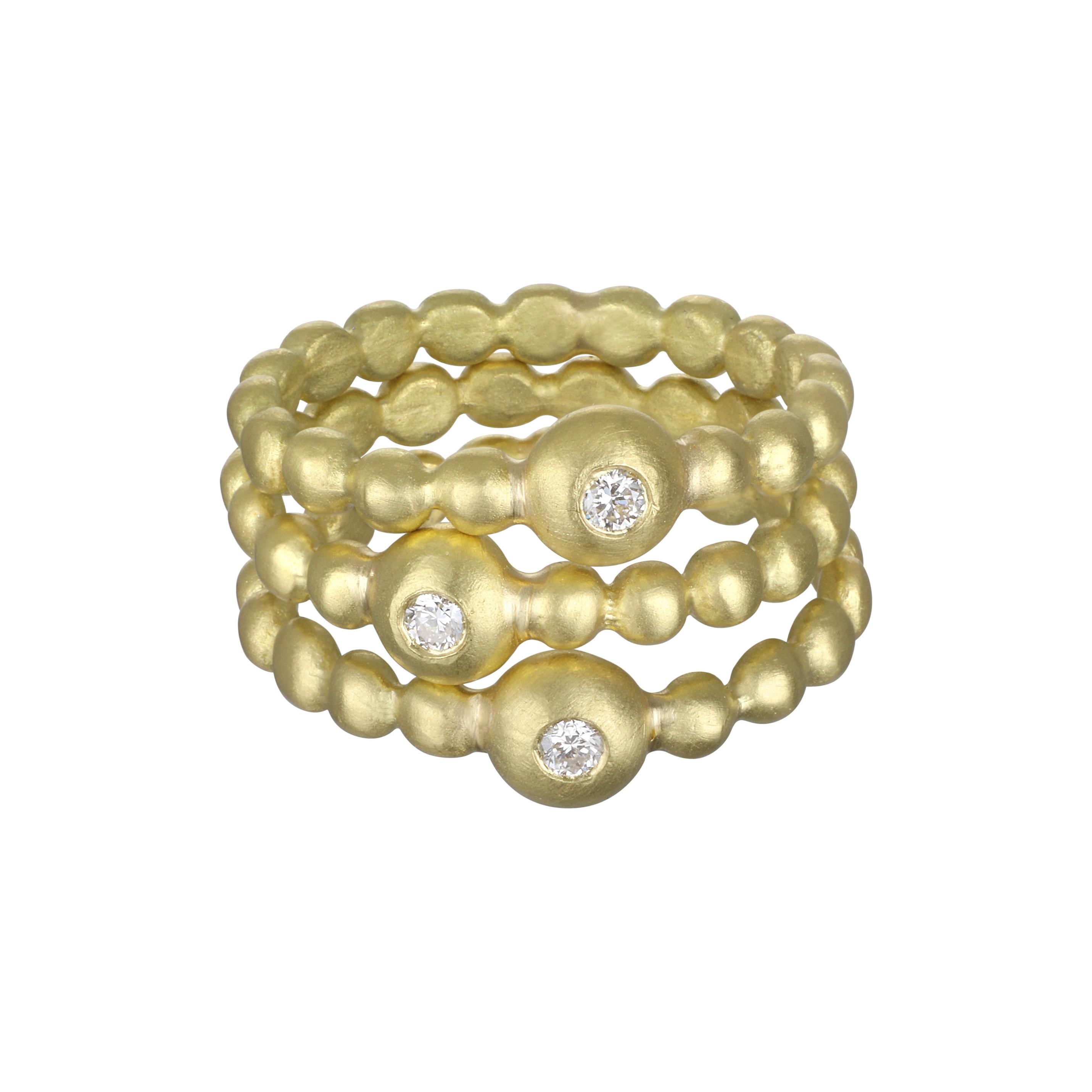 Faye Kim's signature 18k gold diamond bead granulation rings are perfect for stacking.
Each one sparkles with a single round brilliant cut diamond.  Matte finish.
Center Diamond bead 5MM Diameter
Shank 3 MM Wide

Size 6.5  Can be sized
Diamond = .04