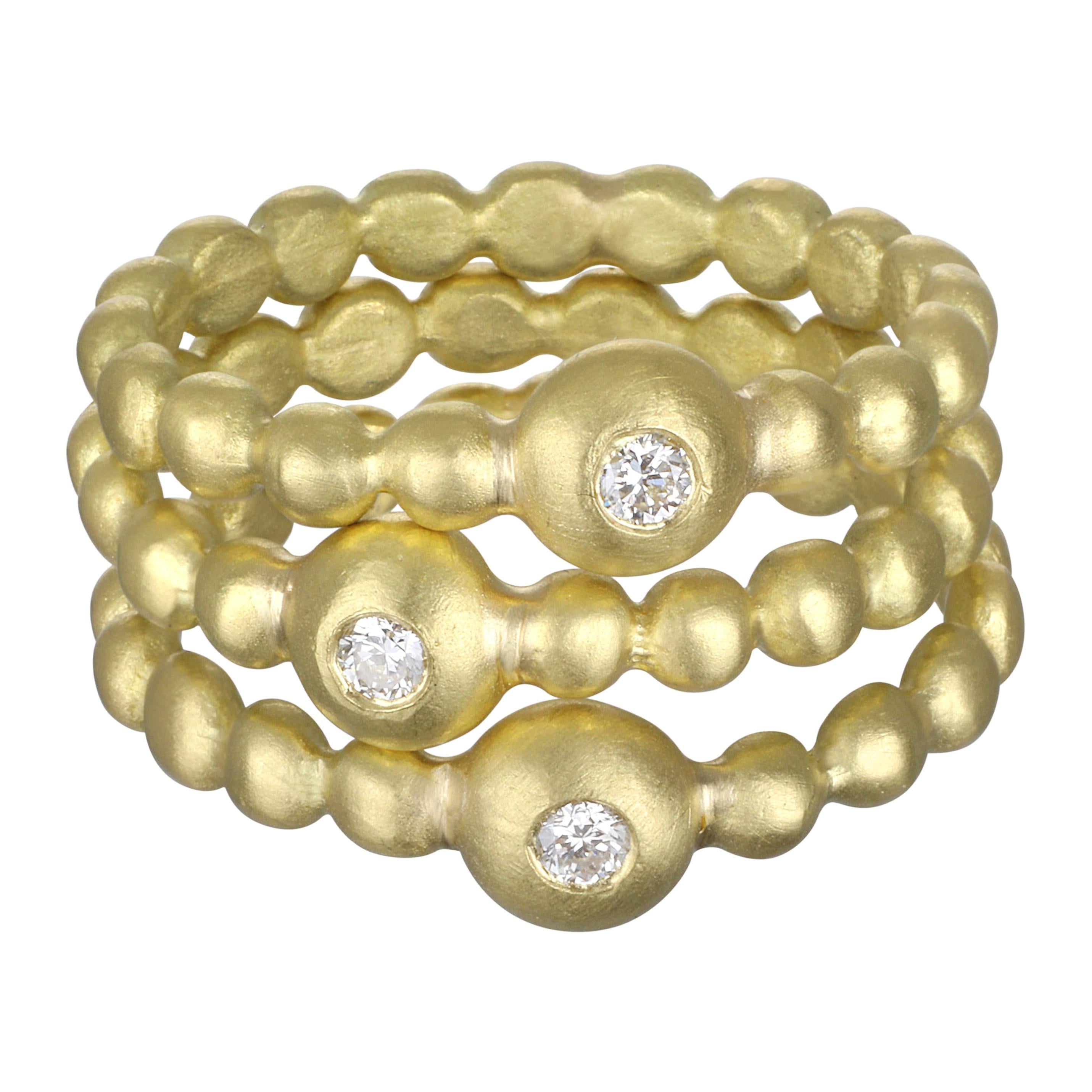 Faye Kim's signature 18karat gold diamond bead granulation ring is perfect for stacking.
Each one sparkles with a single round brilliant cut diamond.  
Matte finish. Each sold separately.

Size 6.5  Can be resized
Diamond = .04 ct

Photos show