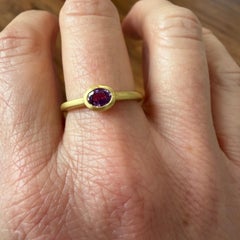 Faye Kim 18 Karat Gold .63 Carat Oval Purple Sapphire Single Stone Bezel Ring