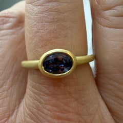 Faye Kim 18 Karat Gold .70 Carat Oval Blue Sapphire Single Stone Bezel Ring