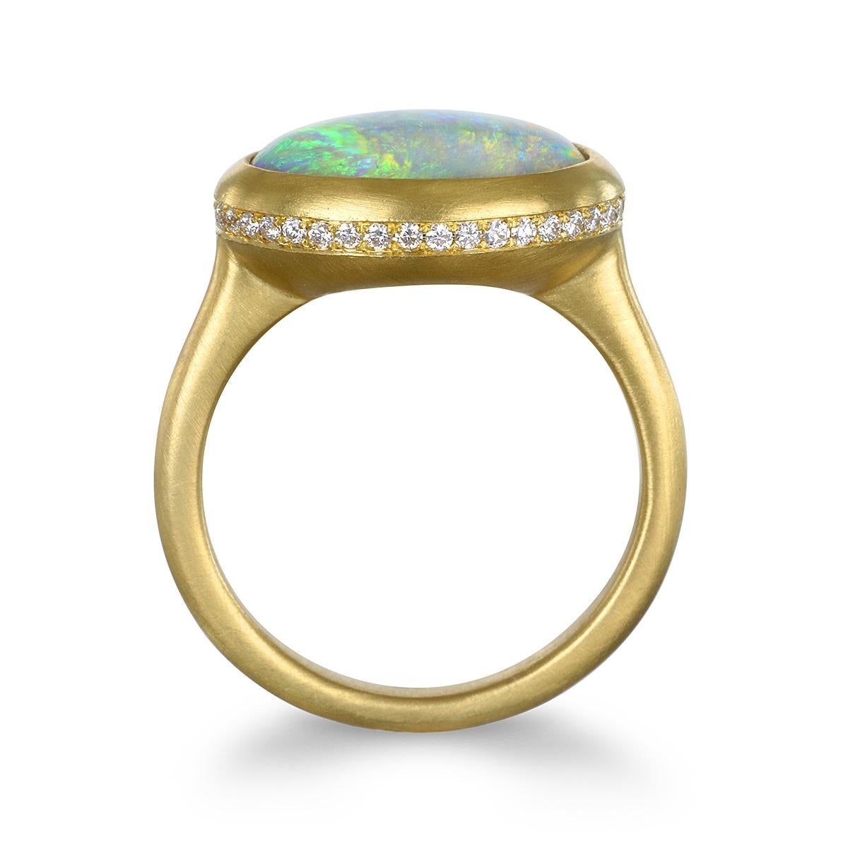 Faye Kim's one of a kind striking Crystal Opal from Corcoran Field of Australia is set in 18k gold* with micro pave diamonds set into the bezel. The ring is a statement piece, and can be worn for any and every occasion.

*In Faye Kim's signature 18k