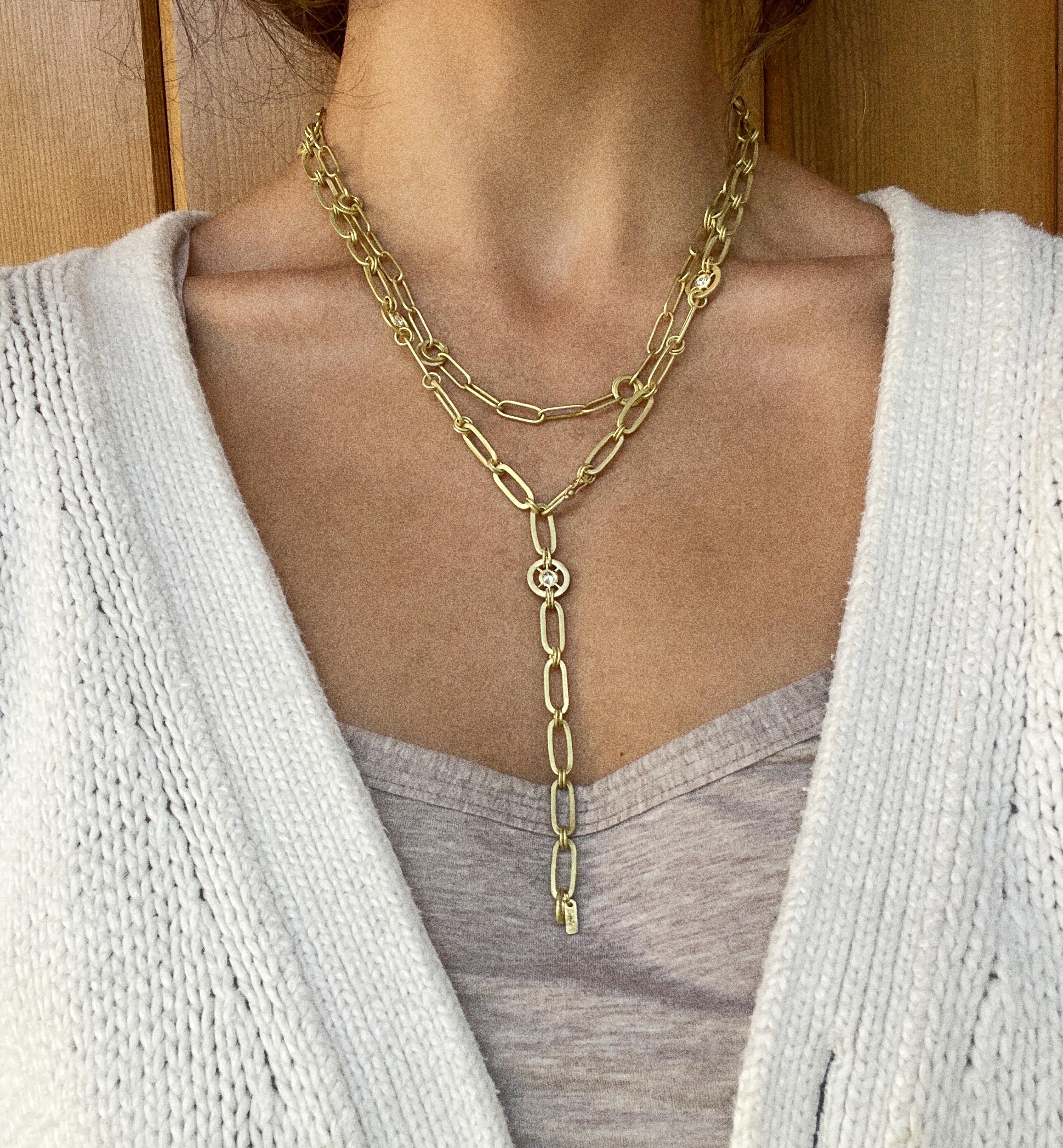 Faye Kim 18 Karat Gold and Diamond Wheel Paperclip Lariat Necklace

Experience everyday luxury in Faye Kim's handcrafted 18k gold and diamond Paperclip necklace. This iconic chain is given a modern twist in a lariat style with diamond pinwheels and