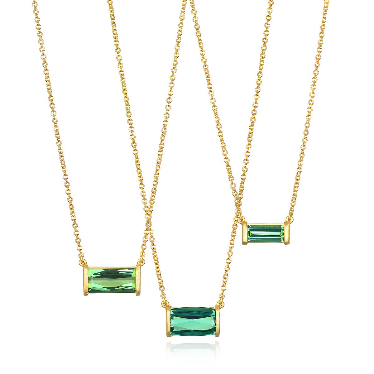 Faye Kim's 18K Gold Bar Set French Cut Green Tourmaline Necklace features a striking, vibrantly-hued gemstone set in a matte gold finish; certain to add sparkle to any wardrobe and can be worn alone or layered with other necklaces. 

Green