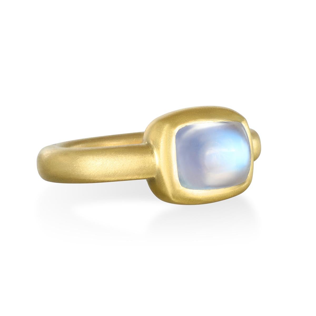 Faye Kim has bezel-set this mesmerizing cushion-cut blue moonstone, with its bluish, milky color, into 18 karat gold. The matte finish complements the beauty of the stone.

Moonstone 3.72 cts
Size 7.25, can be sized

Pictured with similar 18k Gold