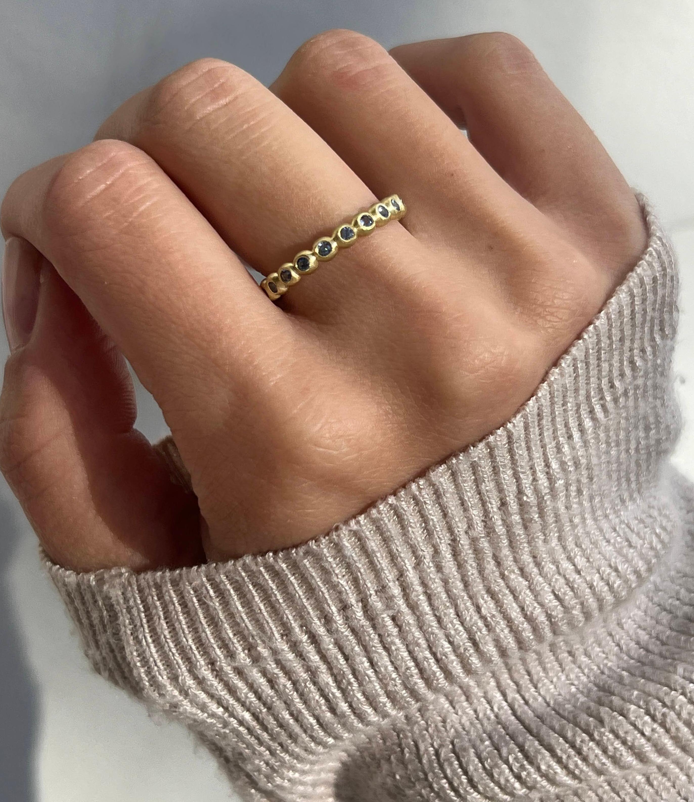 Faye Kim's lustrous Blue Sapphire Granulation Bead Ring is handcrafted in 18 karat gold and matte finished for a contemporary look. Wear alone or stacked with others to express your own unique style. 

Sapphire .40 Carats twt
Band width 3mm
Size 7,