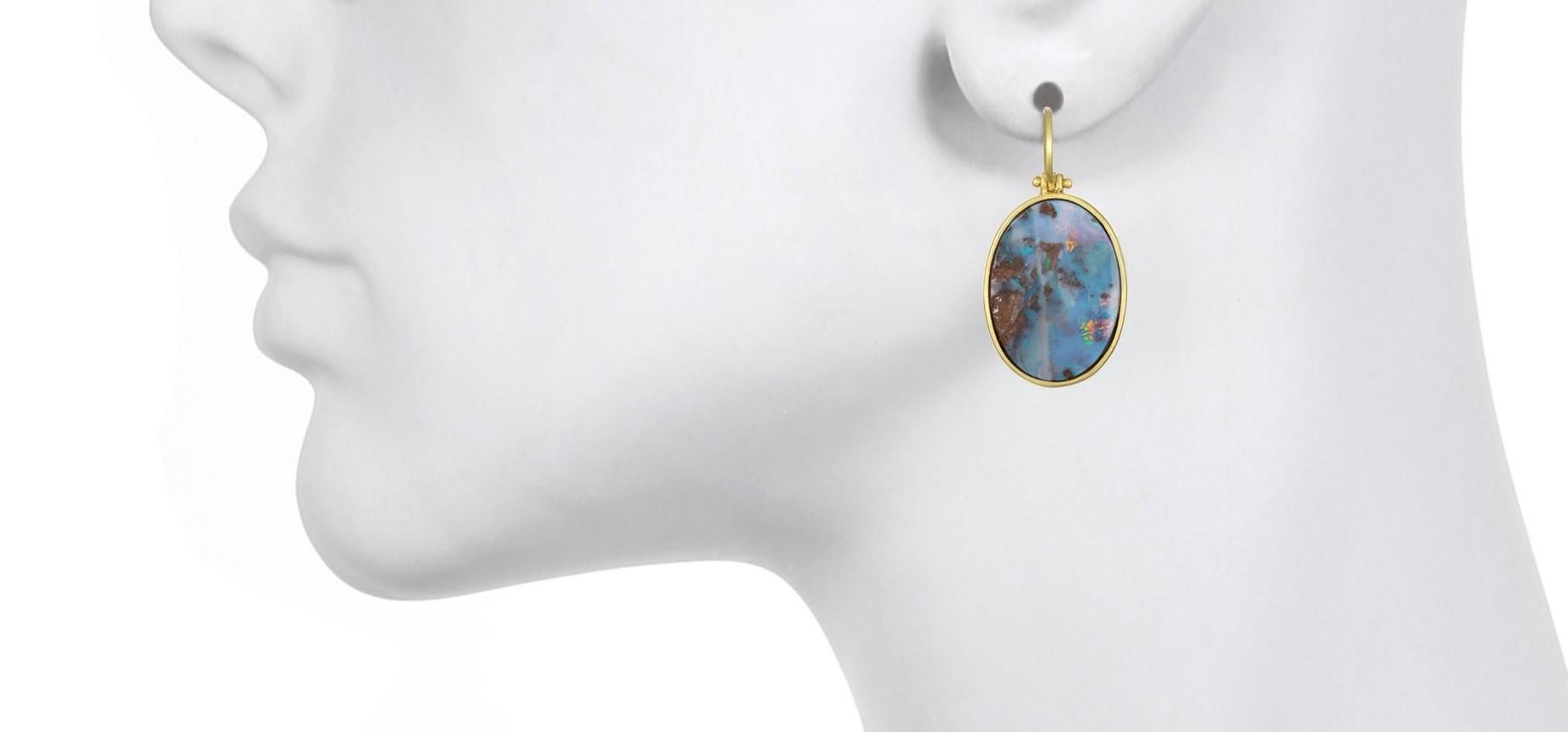 Unique in every way.  These fine natural Boulder Opal split earrings are expertly set in 18k gold bezels with hinged earwire for movement.  The intense and deep color is highlighted throughout the full carat weight of 16.45.  Organic feel, matte