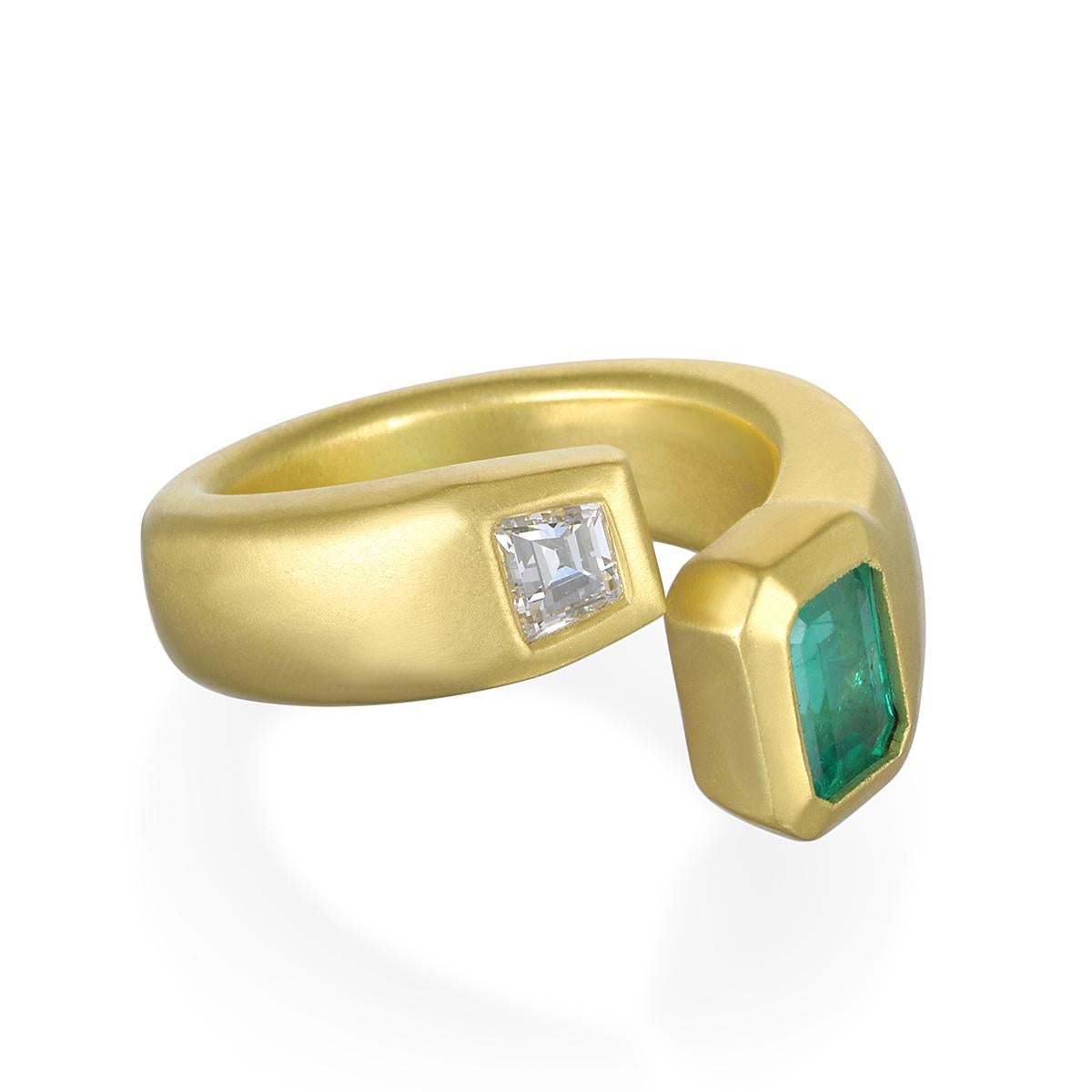 Make a statement with this spectacular Brazilian Emerald and Trapezoid Diamond Open Wrap Ring. Comprising 18 karat matte gold, it would be perfect worn on any finger.

Emerald: .90 Carats
Diamond: .31 Carats 
Bezel taper 10mm x 6.5mm
Size 7, ring