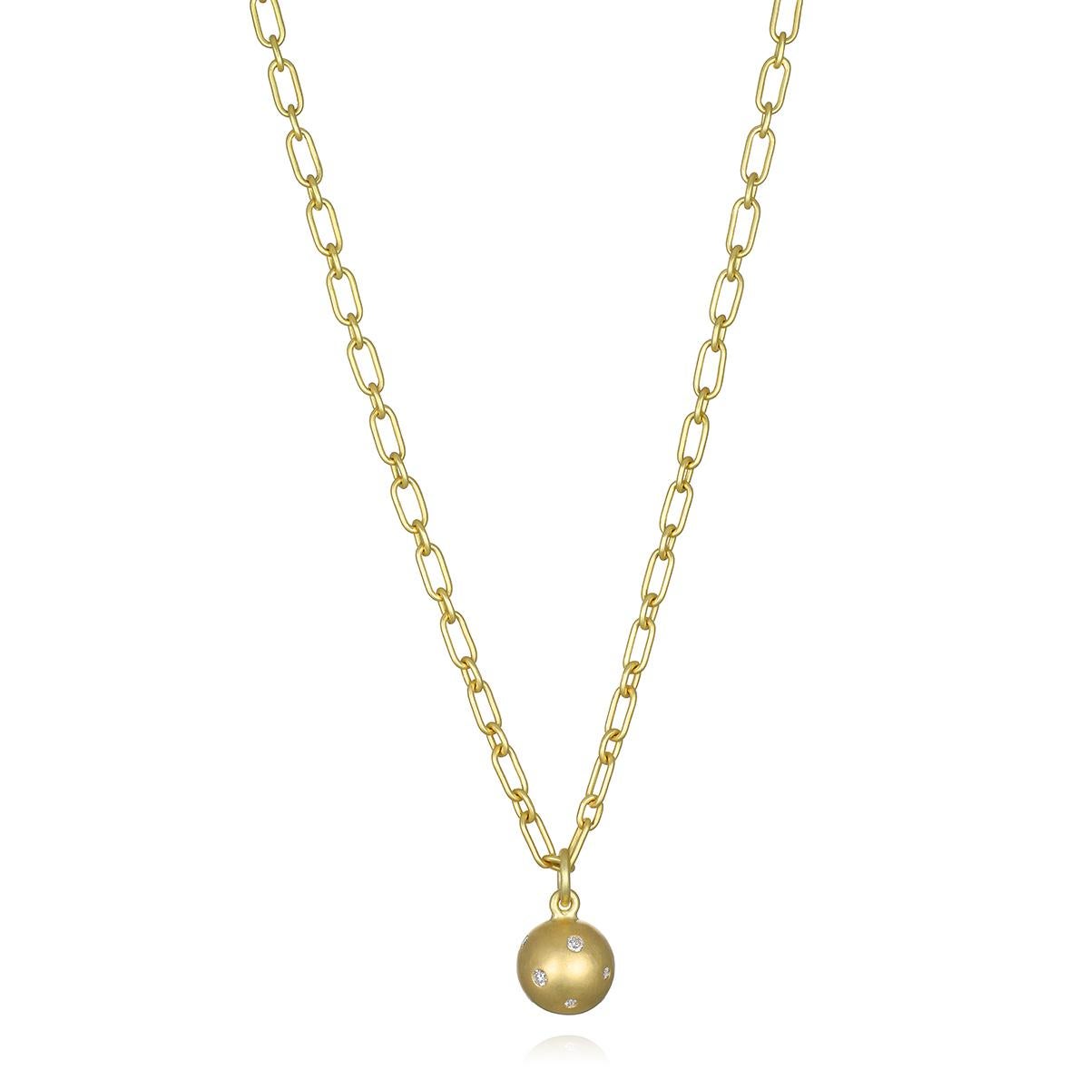 Faye Kim's 18 Karat Gold Burnished Diamond Ball Charm, with its solid gold construction and diamond-studded surface, offers the perfect weight and just the right amount of shine and sparkle. Worn alone or layered with other necklaces and charms,