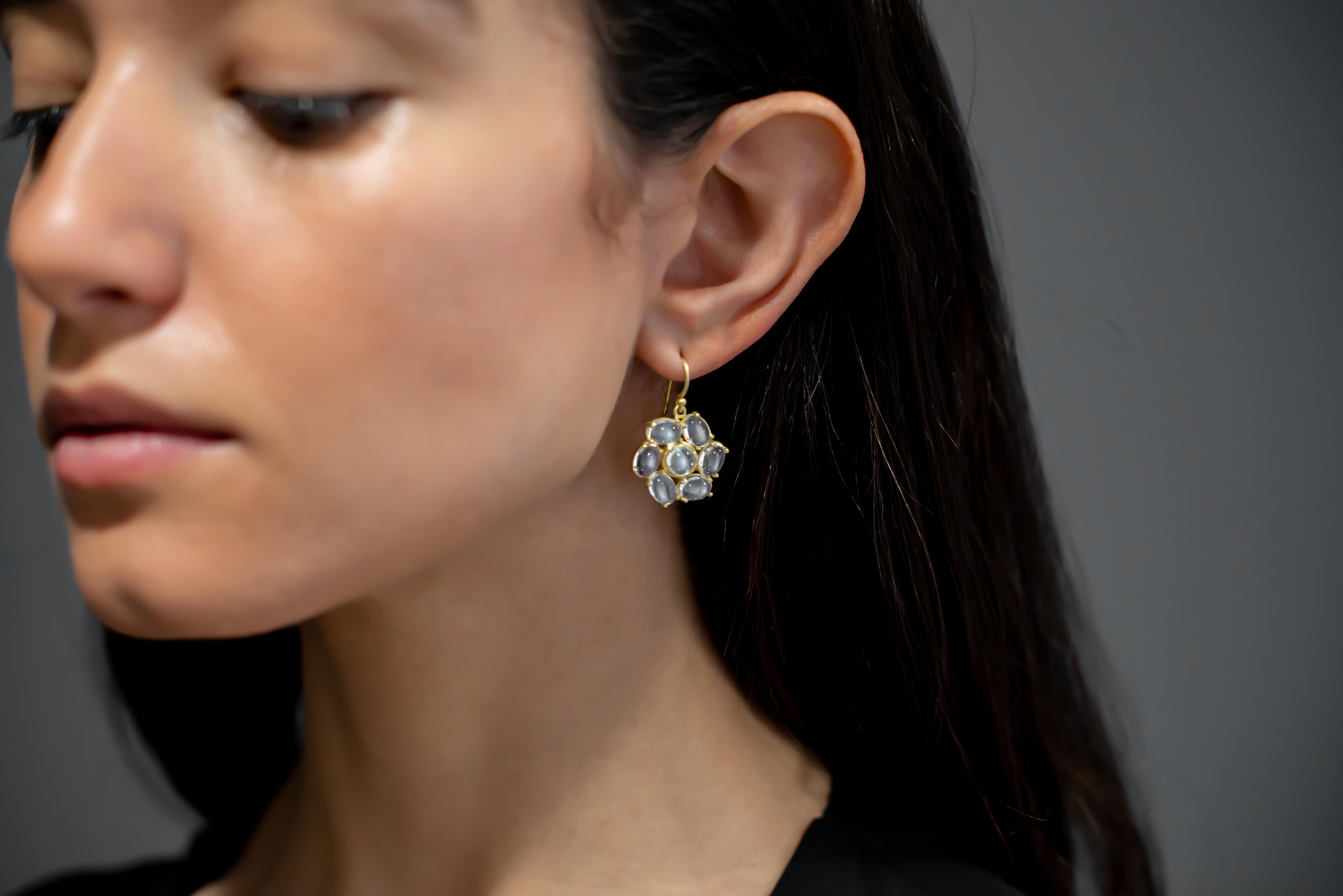 18k Gold Ceylon Moonstone Daisy Earrings.  Known for its adularescence, the blue flash from Ceylon moonstones adds to the overall mystique surrounding moonstones. In some cultures, moonstone is known as the stone of protection and considered sacred