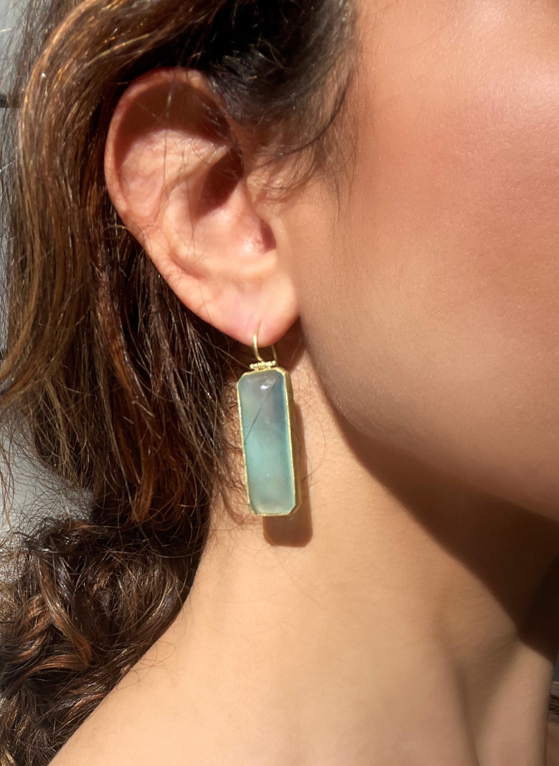 Faye Kim's 18 Karat Gold Chalcedony Earrings, with their translucent blue-gray color, are beautiful in their simplicity and offer the perfect pop of color. 

Length 1.5