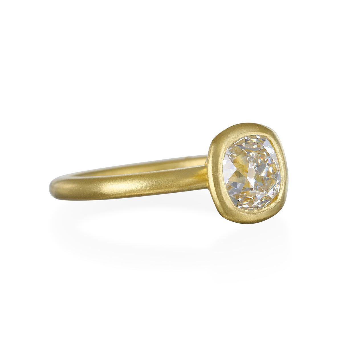 Faye Kim's Cushion Brilliant Cut Diamond Ring features an open bezel in 18 karat gold with a matte finish. Can be mixed and stacked with other rings for a custom look.

Diamond 1.04 Carats 
Quality I Color/SI Clarity

Size 7.25, can be