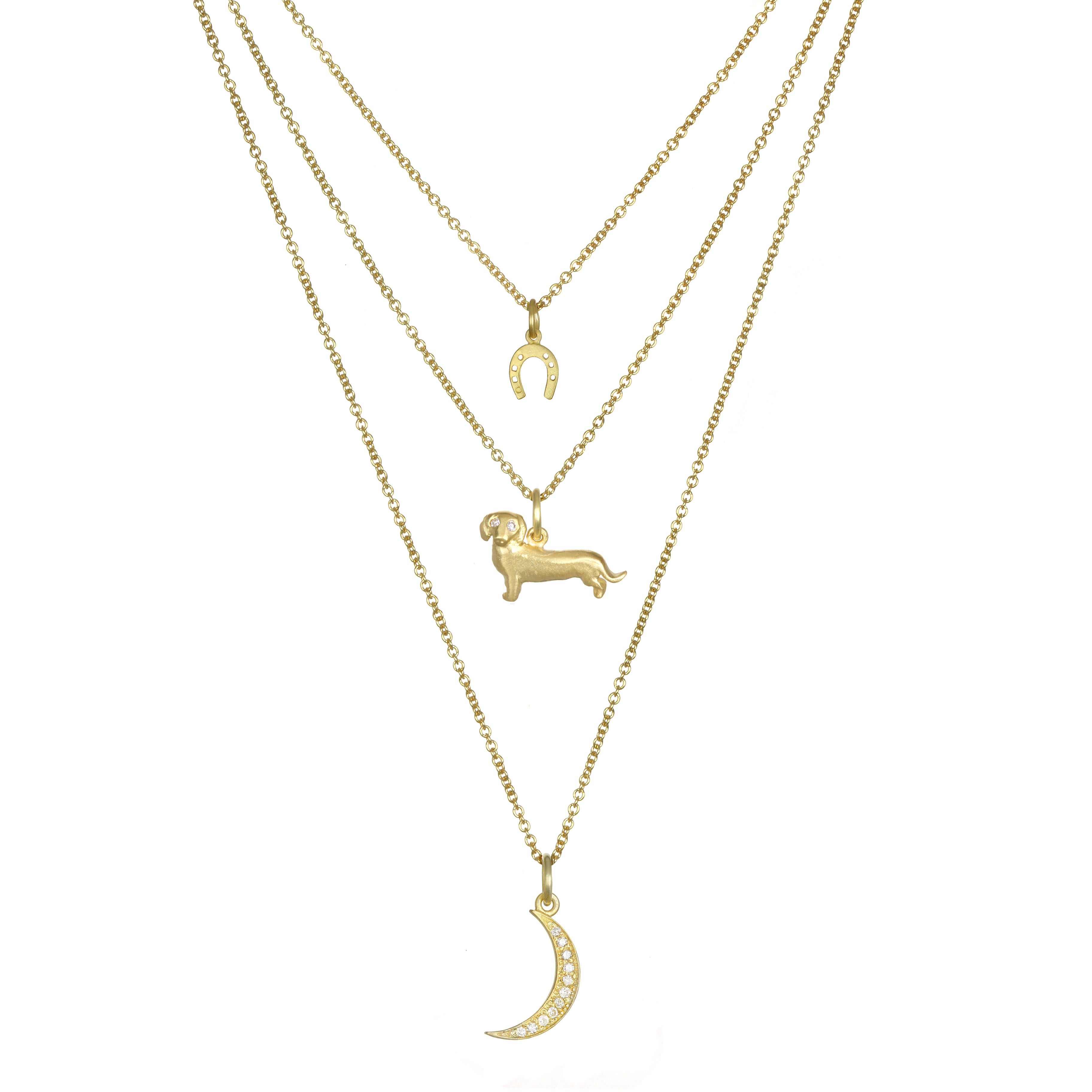 For the Dachshund Lover - symbolizing loyalty, faithfulness, and love. Crafted in 18K Green Gold with White Diamond eyes. The cable chain is 16-18