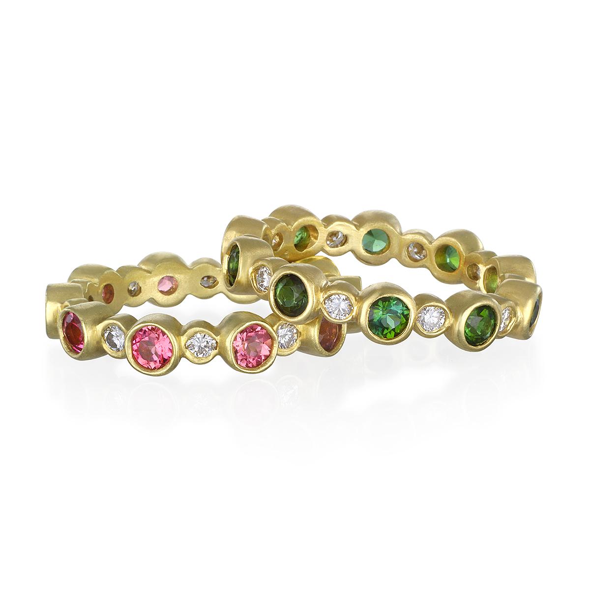Great for stacking!
Classic eternity band with bezel set diamonds and pink Tourmaline in 18k gold.  Wear alone or stack with other colors.  This ring is also available with green Tourmaline.   
Size 6.5.  
Diamonds:  .38 carats twt. 
Width: