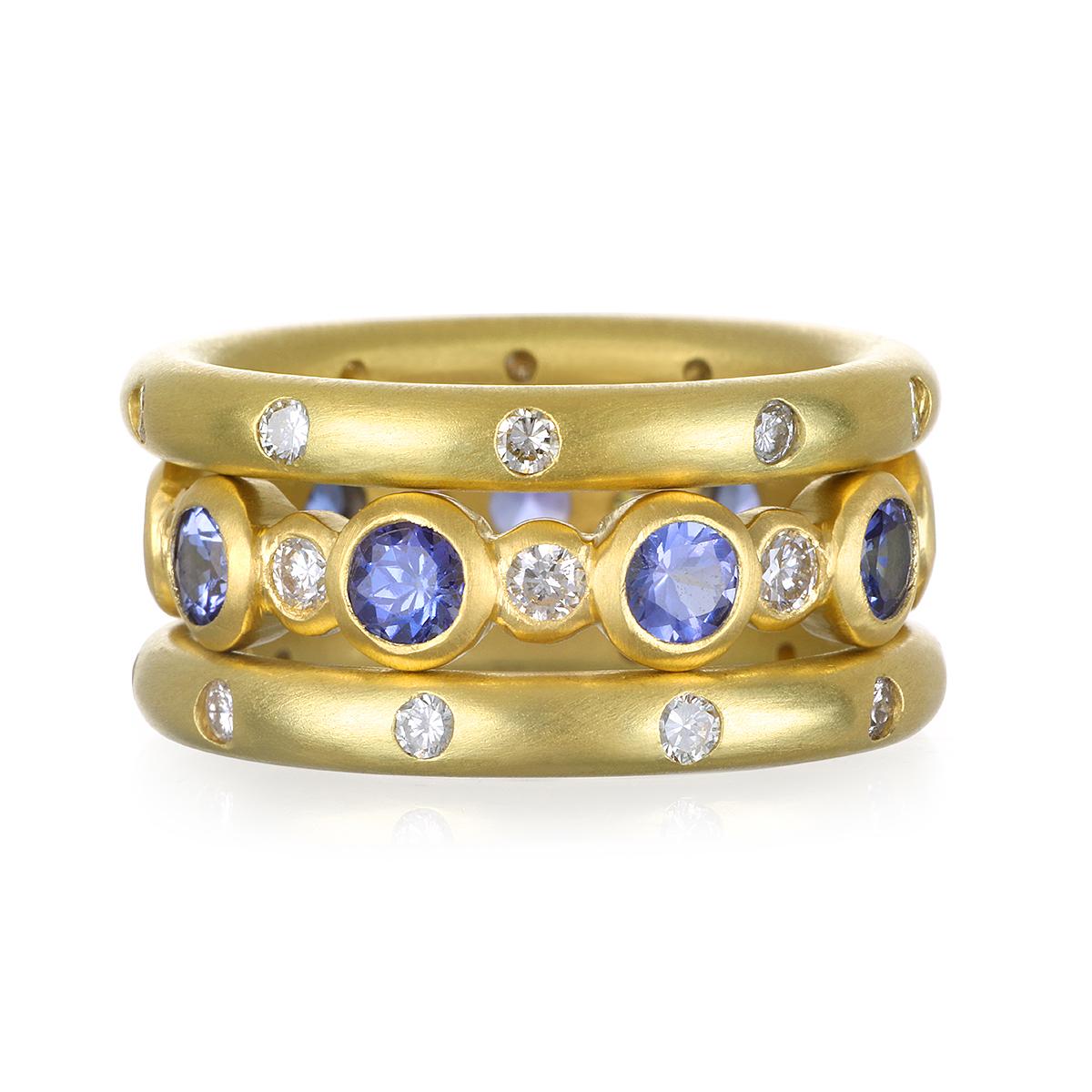 Faye Kim 18K Gold Diamond and Tanzanite Eternity Ring. 
Classic eternity band with bezel set diamonds and Tanzanite in 18k gold. Wear alone or stack with other colors. 

Size 7.25
Diamonds: .38 tcw
Tanzanite: 2.01 tcw
Width 4.8mm

Made in the USA