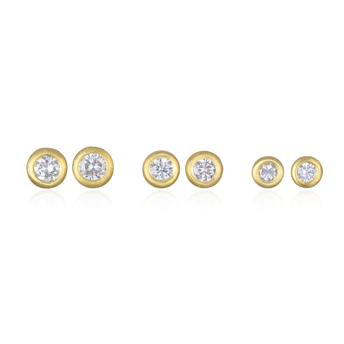 Faye Kim's 18 Karat Gold Diamond Martini Bezel Stud Earrings, with their clean, modern setting and matte finish, are the quintessential perfect pair of diamond stud earrings. With just enough sparkle to get noticed but with understated elegance,