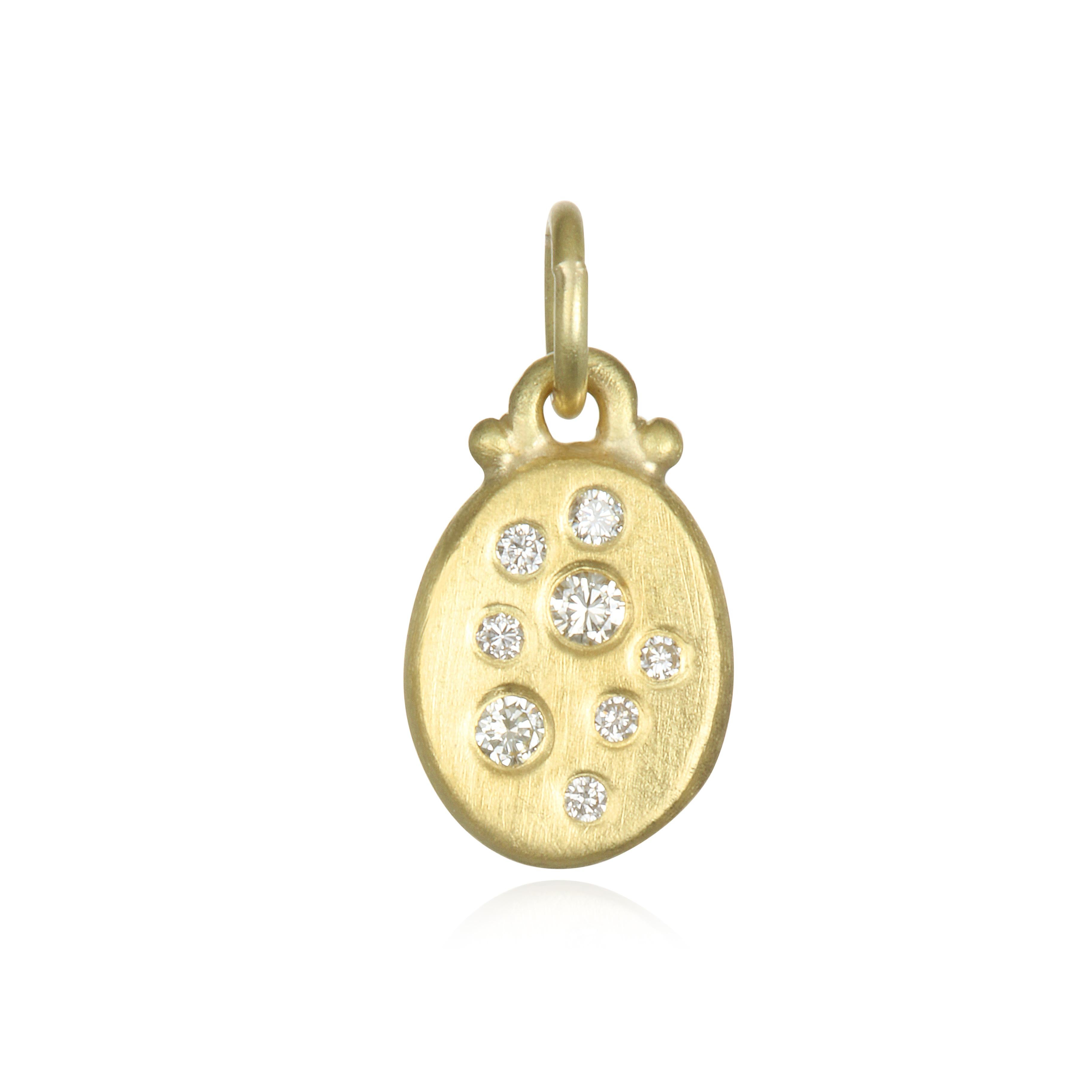 Versatile and easy to wear, the mini version of Faye Kim's popular larger diamond Dog Tag pendants is perfect for both every day and special occasion wear. The pendant is matte-finished in 18 Karat Gold. Whether worn alone or layered with other