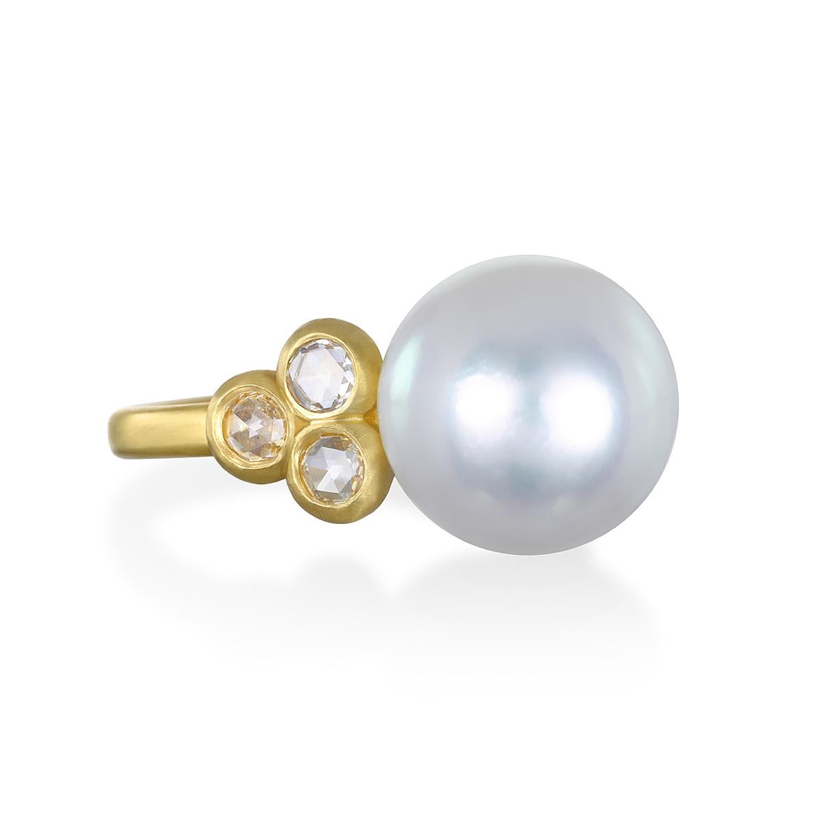 Faye Kim's 18 Karat Gold Diamond White South Sea Pearl Ring highlights the classic beauty of South Sea pearls made wearable for today's contemporary styles. Three bezel-set rose cut diamonds on either side of the pearl add just the right amount of