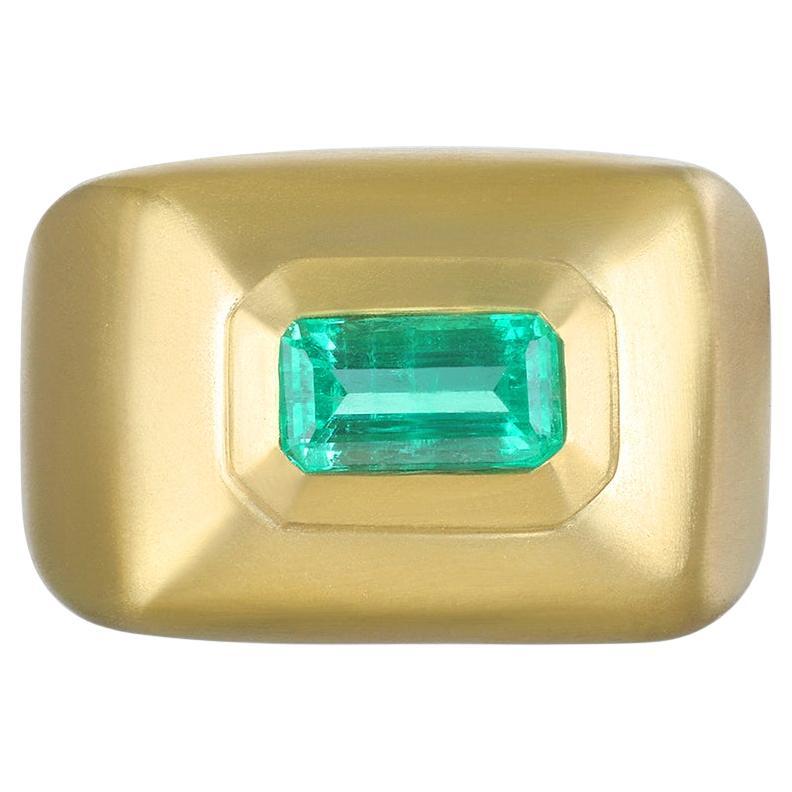Through time, the emerald has been considered a symbol of truth and love. Here, Faye Kim has created this striking 18 Karat Gold Emerald Bezel Dome Ring, ideal as an engagement ring, statement ring, or for layering and stacking with other