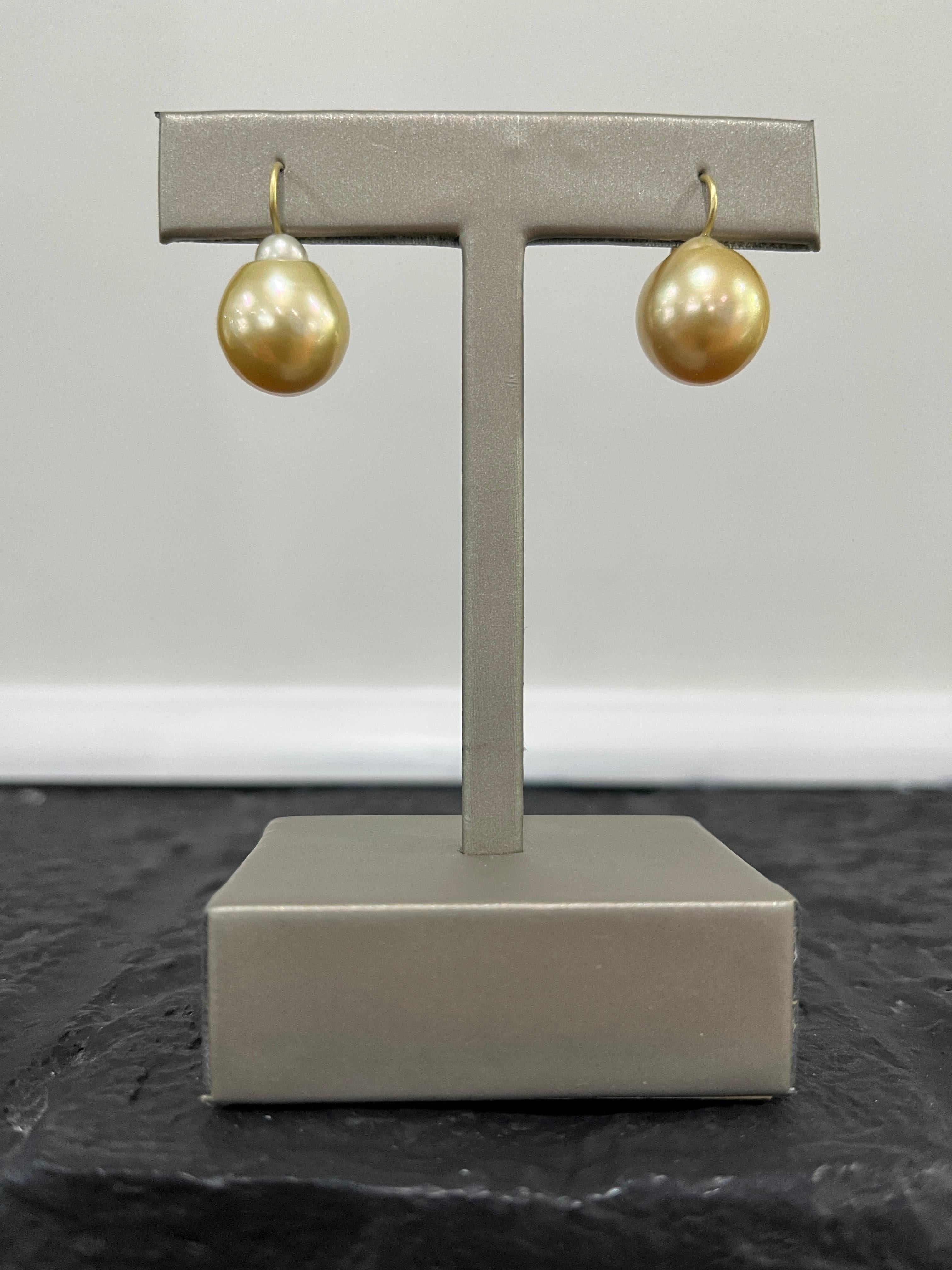 Classic, timeless, and simply chic, Faye Kim's lustrous 18 Karat Gold Golden Baroque South Sea Pearl Drop Earrings are finished with 18 Karat Gold ear wires. These earrings will never go out of style, look beautiful against the skin and can be