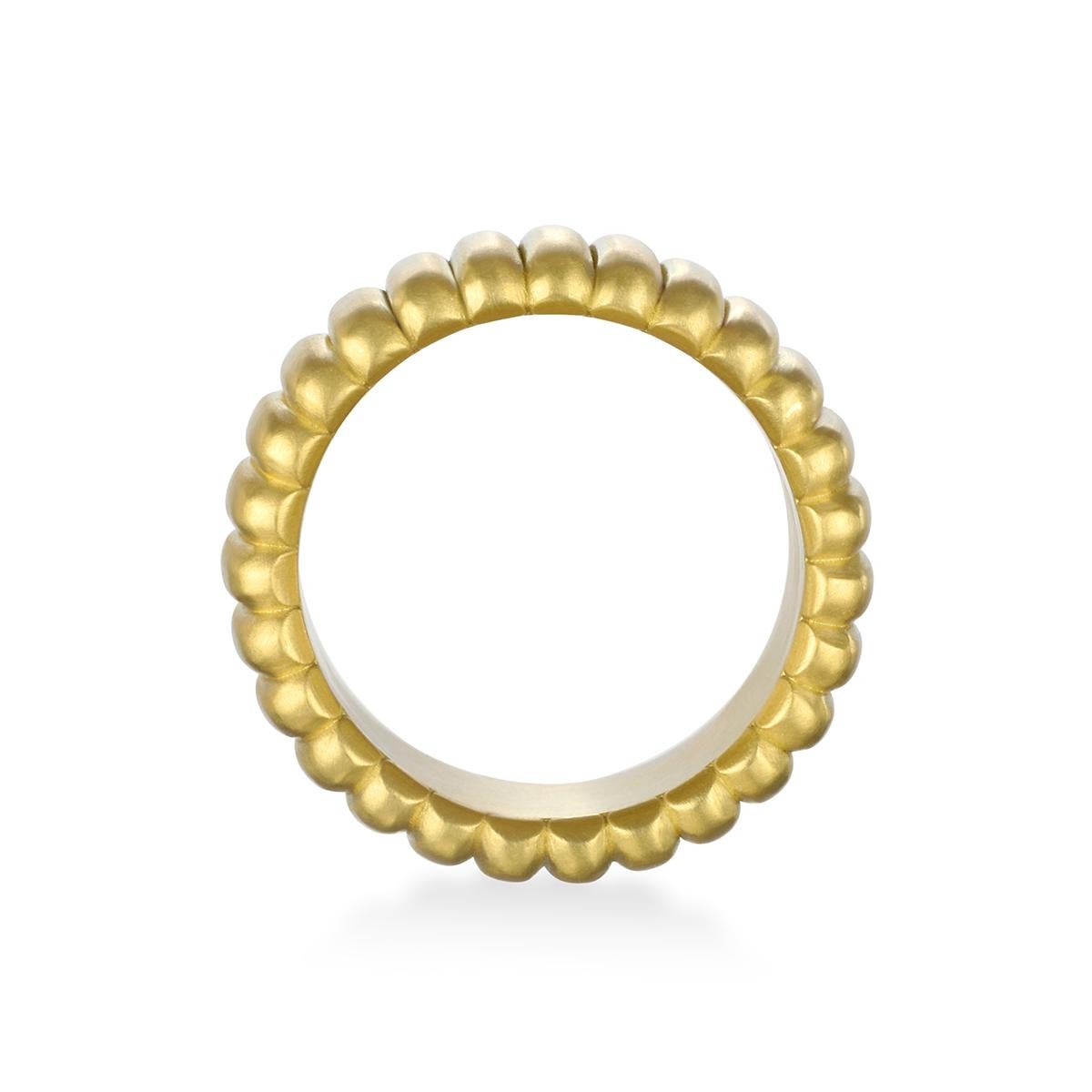 Crafted from solid 18 Karat Gold, Faye Kim's Grooved Band Ring, with its textured surface, blends both classic, timeless style with modern luxury. 

Width 12mm

Size: 7.75, can be sized

Made in the USA

