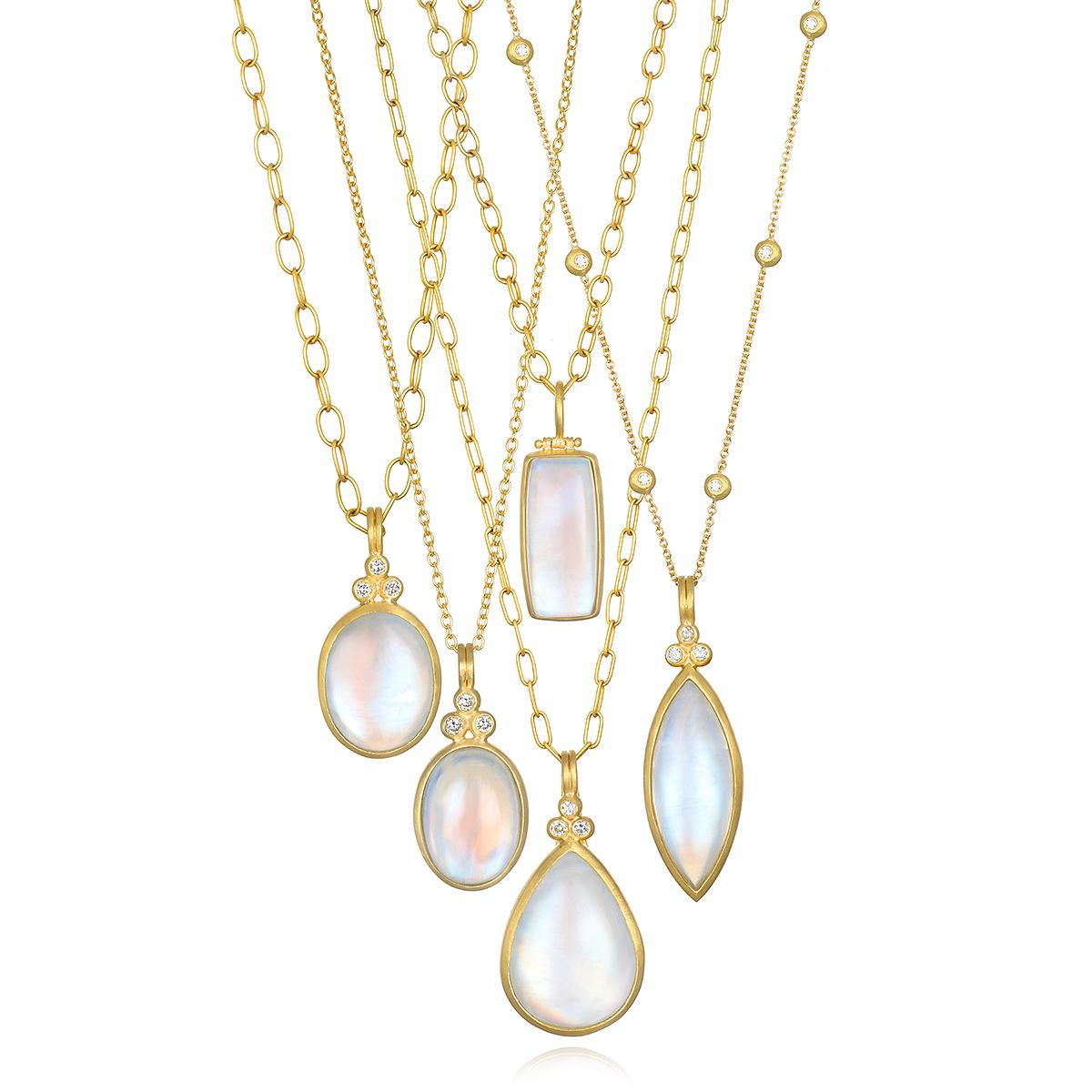 This spectacular Faye Kim 18 Karat Gold Hinged Bail Moonstone Pendant is full of light and reflects beautiful translucent blue hues. The moonstone's rectangular shape is both modern and organic, evoking a feeling a serenity. The pendant's